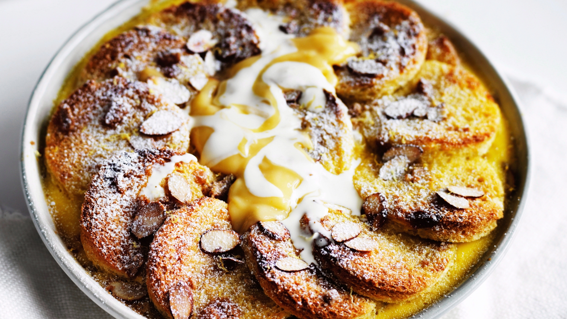 Lemon curd and almond bread and butter pudding