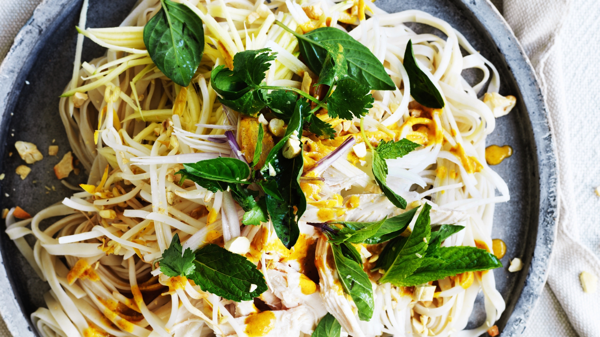 Tangy chicken noodles with turmeric-lime dressing