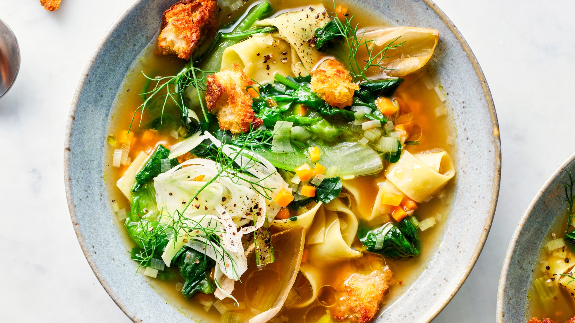 Torn pasta soup with parmesan croutons