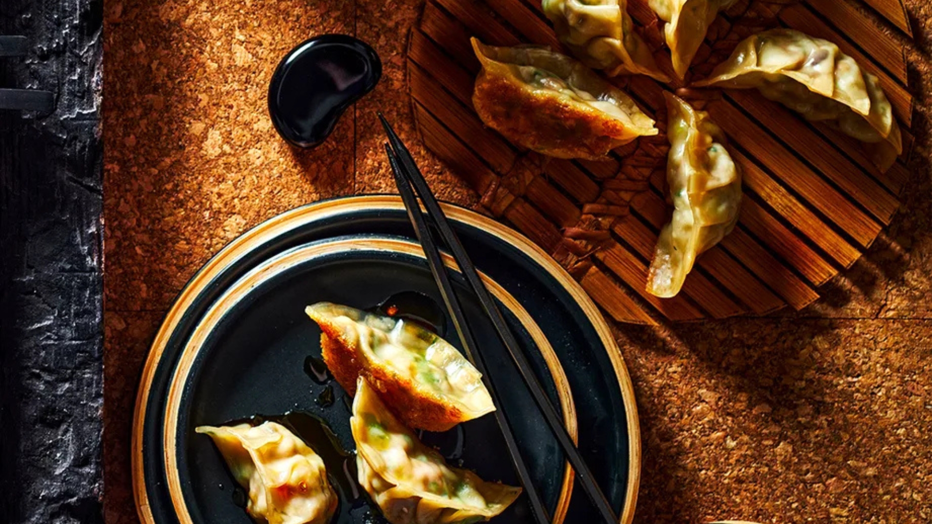 Crisp pork and ginger gyozas with sesame rayu sauce