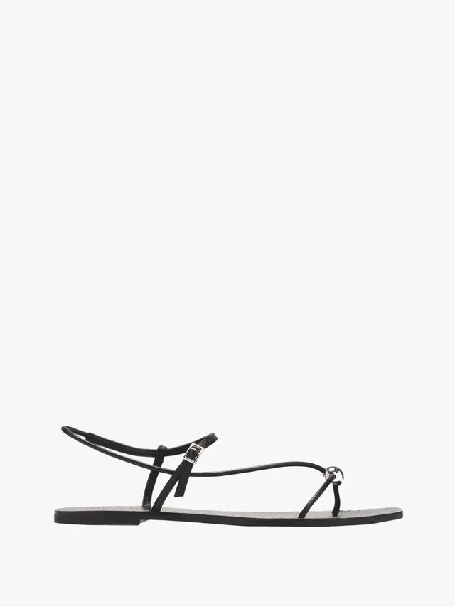 As for how to style your brand new midi, Loeffler Randall's embellished black sandals are a simple yet sleek finishing touch. Don't miss the metallic accent on the strap!