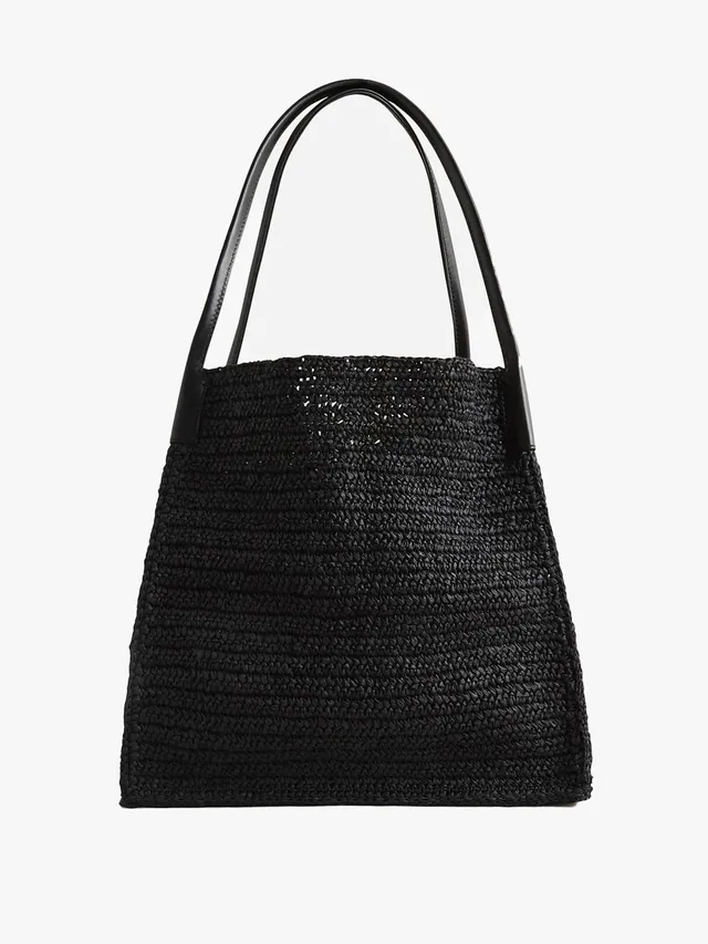 To the sea shore and beyond! J.Crew's roomy raffia tote is built for soaking up the sun this summer.