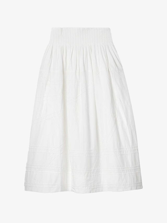 Always essential, the white cotton skirt is as integral to a summer wardrobe as a white T-shirt. Wear yours with stripes, dots, or florals for a touch of print—and whimsy.