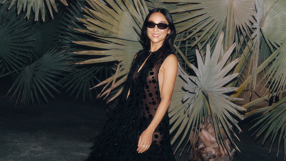 Image may contain: Greta Lee, Adult, Person, Clothing, Dress, Sleeve, Beachwear, Fashion, Accessories, and Sunglasses