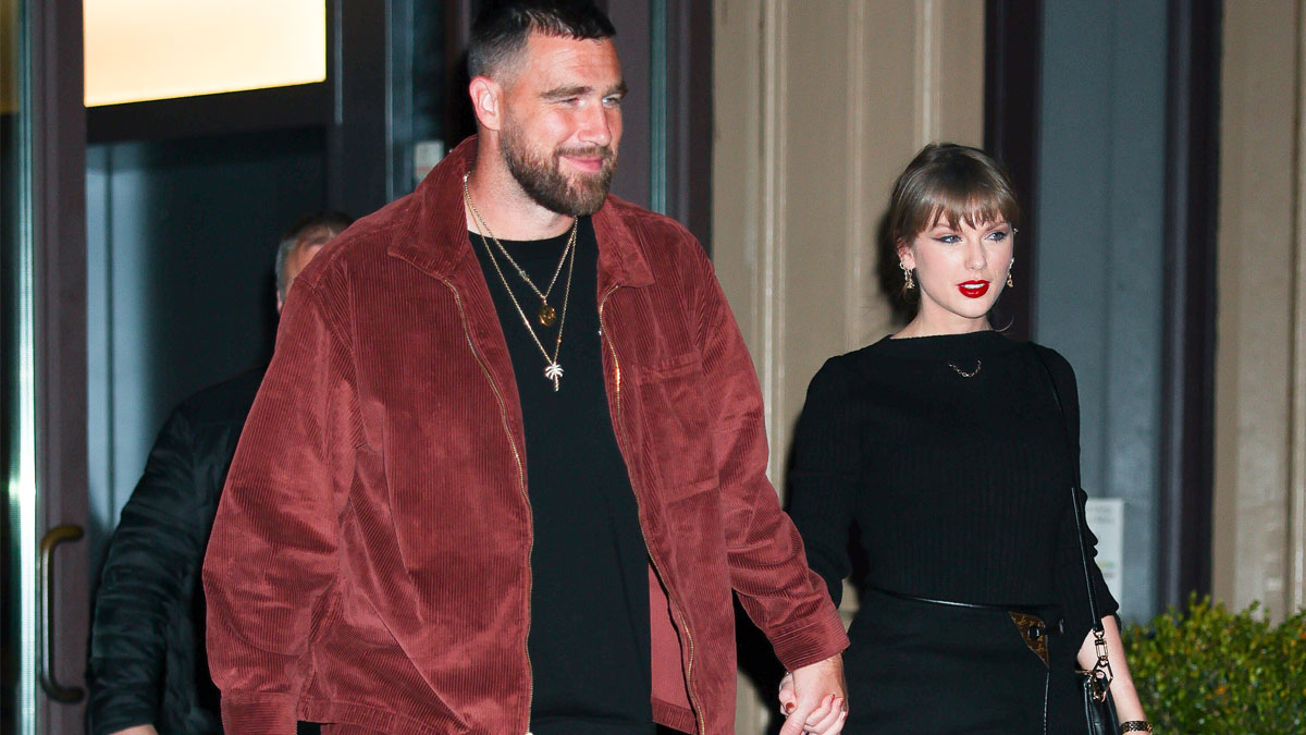 Image may contain: Travis Kelce, Taylor Swift, Fashion, Formal Wear, Clothing, Dress, Blazer, Coat, Jacket, Suit, and Adult