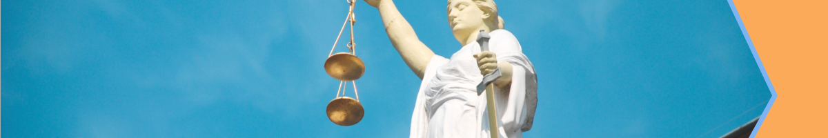 Image of a statue holding scales and a sword.