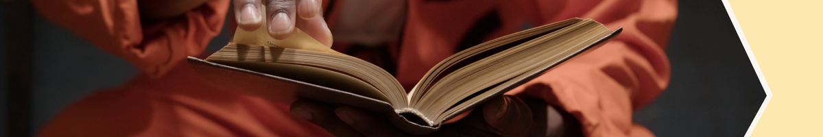 Photo of hands reading a book
