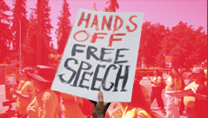 Protestor with sign that reads hands off free speech