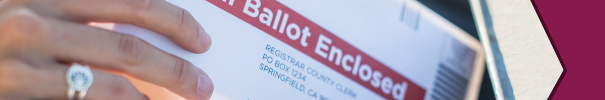 Person holding a mailed ballot