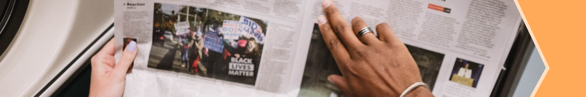 Person reading newspaper