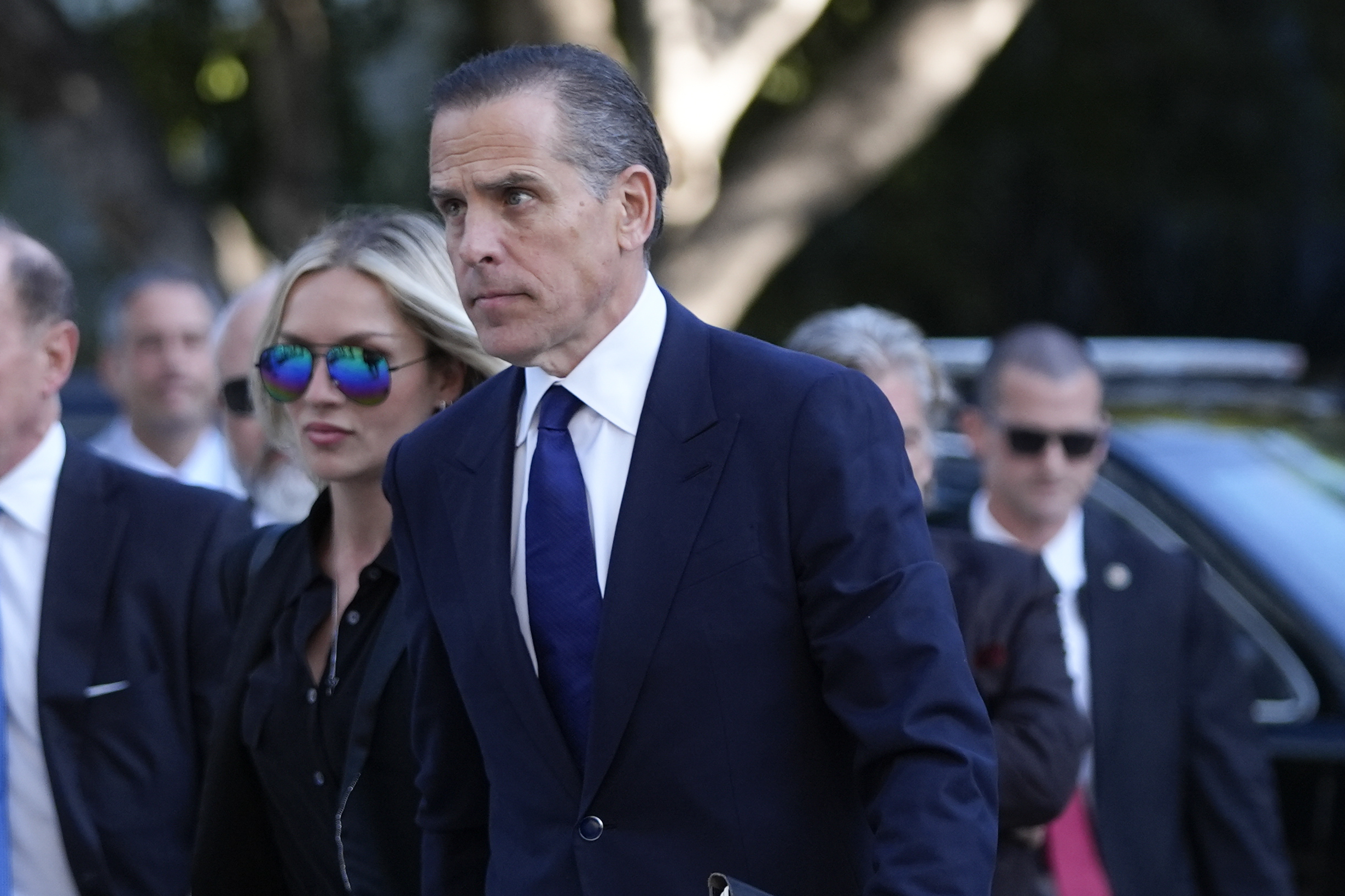 Hunter Biden, center, and his wife Melissa Cohen Biden, arrive in federal court for jury selection for his trial on felony tax charges on Thursday.