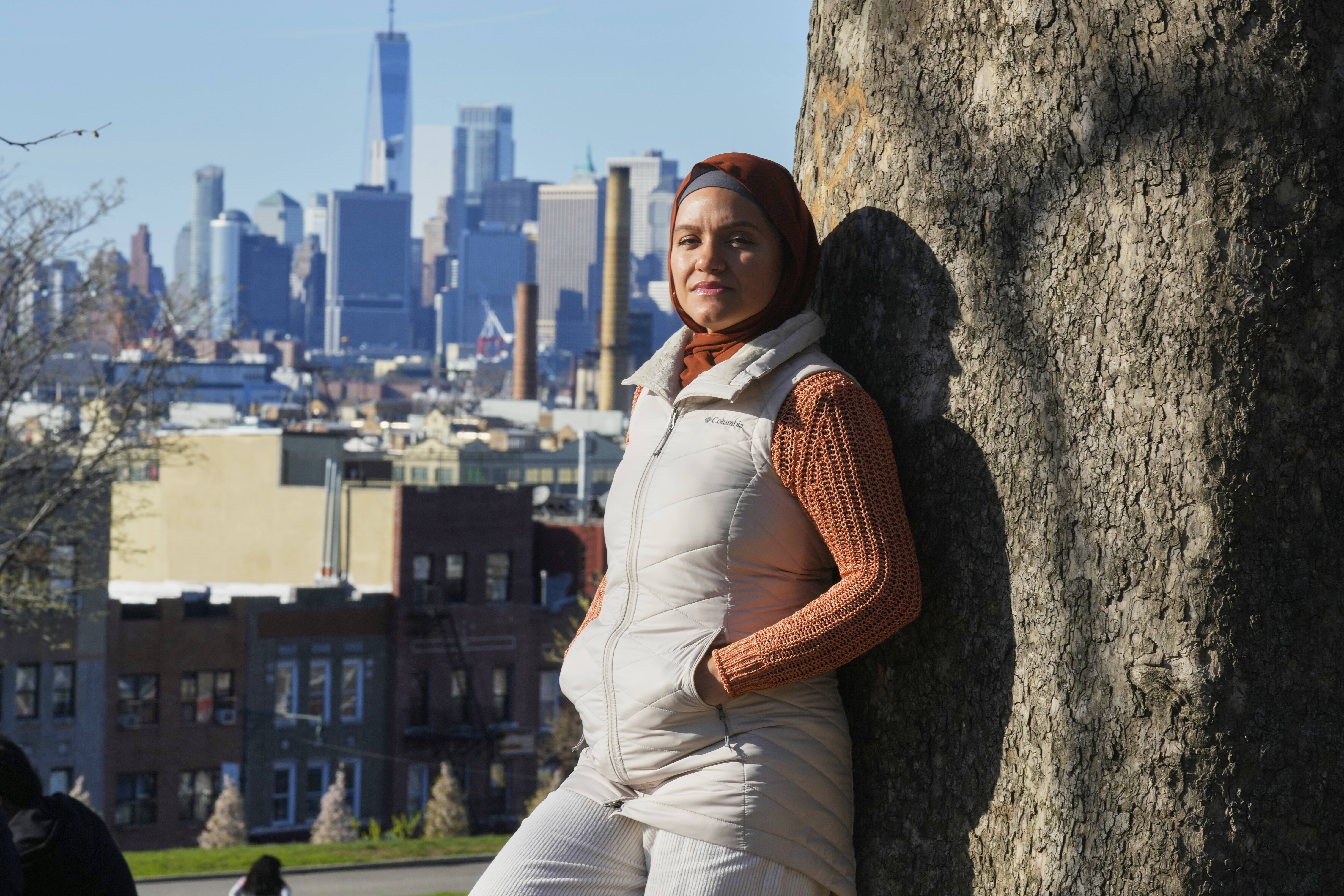 Daniris Espinal stands for a portrait in Sunset Park, in the Brooklyn borough of New York on Thursday. (AP Photo/Richard Drew).