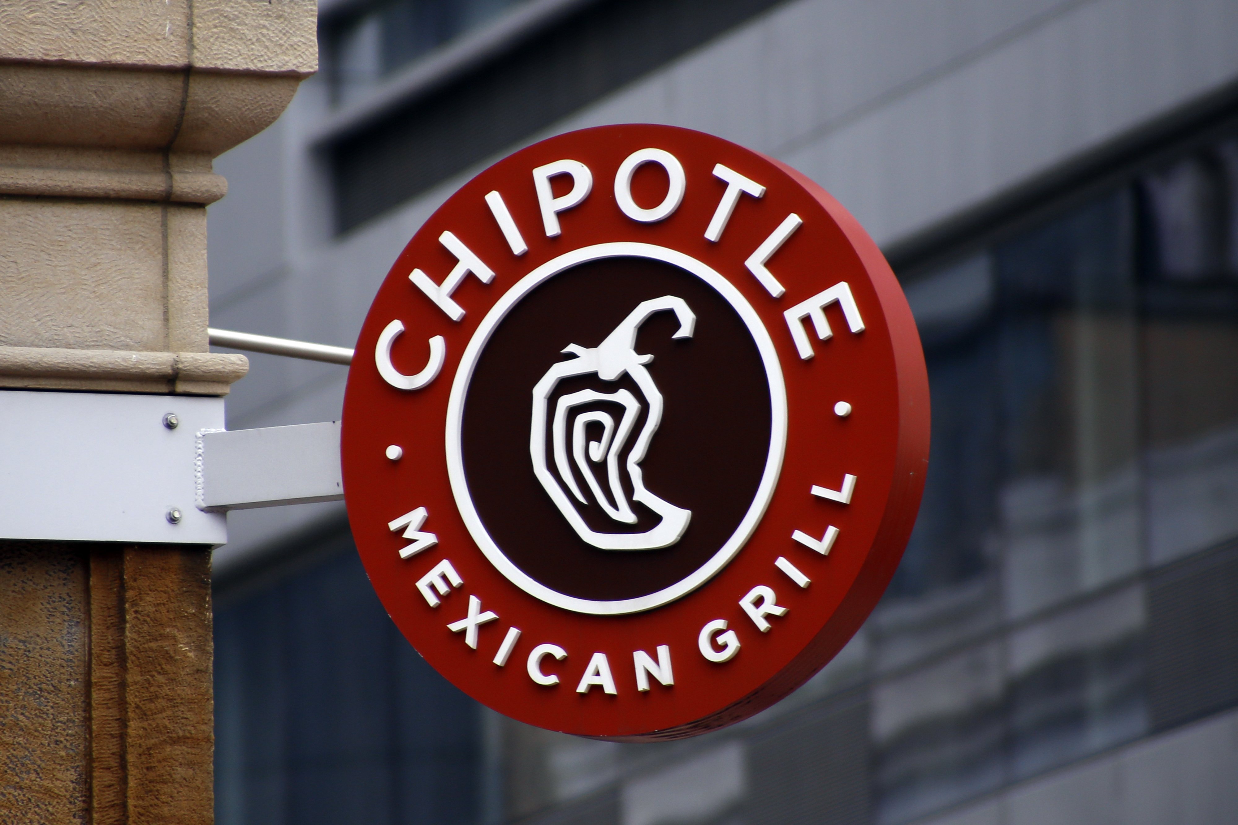 A sign for the Chipotle restaurant in Pittsburgh's Market Square is seen in 2016. (AP Photo/Keith Srakocic, File).