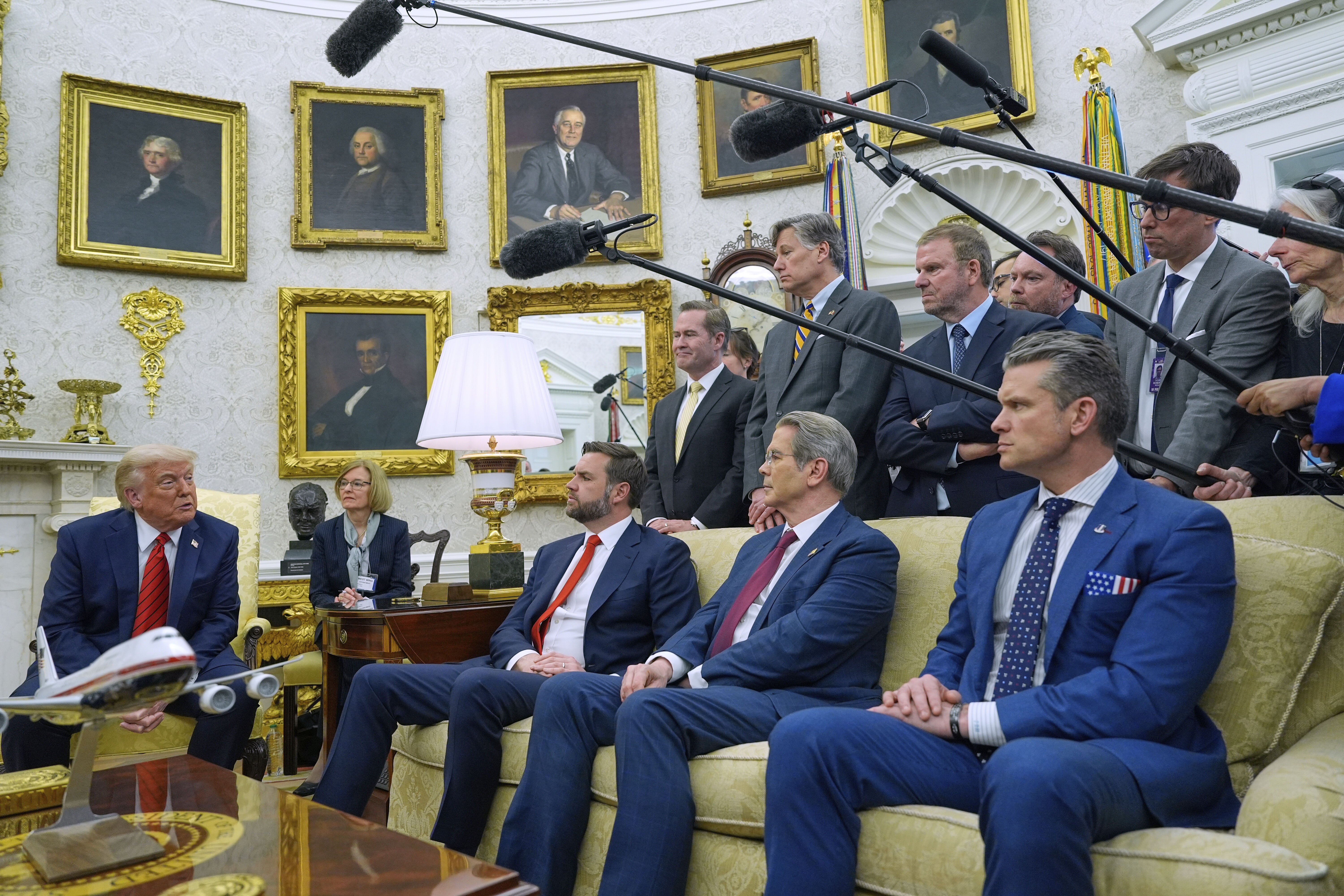 President Donald Trump speaks while meeting with Italy's Prime Minister Giorgia Meloni (unseen) in the Oval Office of the White House on Thursday, as Vice President JD Vance, Treasury Secretary Scott Bessent and Defense Secretary Pete Hegseth listen. (AP Photo/Alex Brandon).