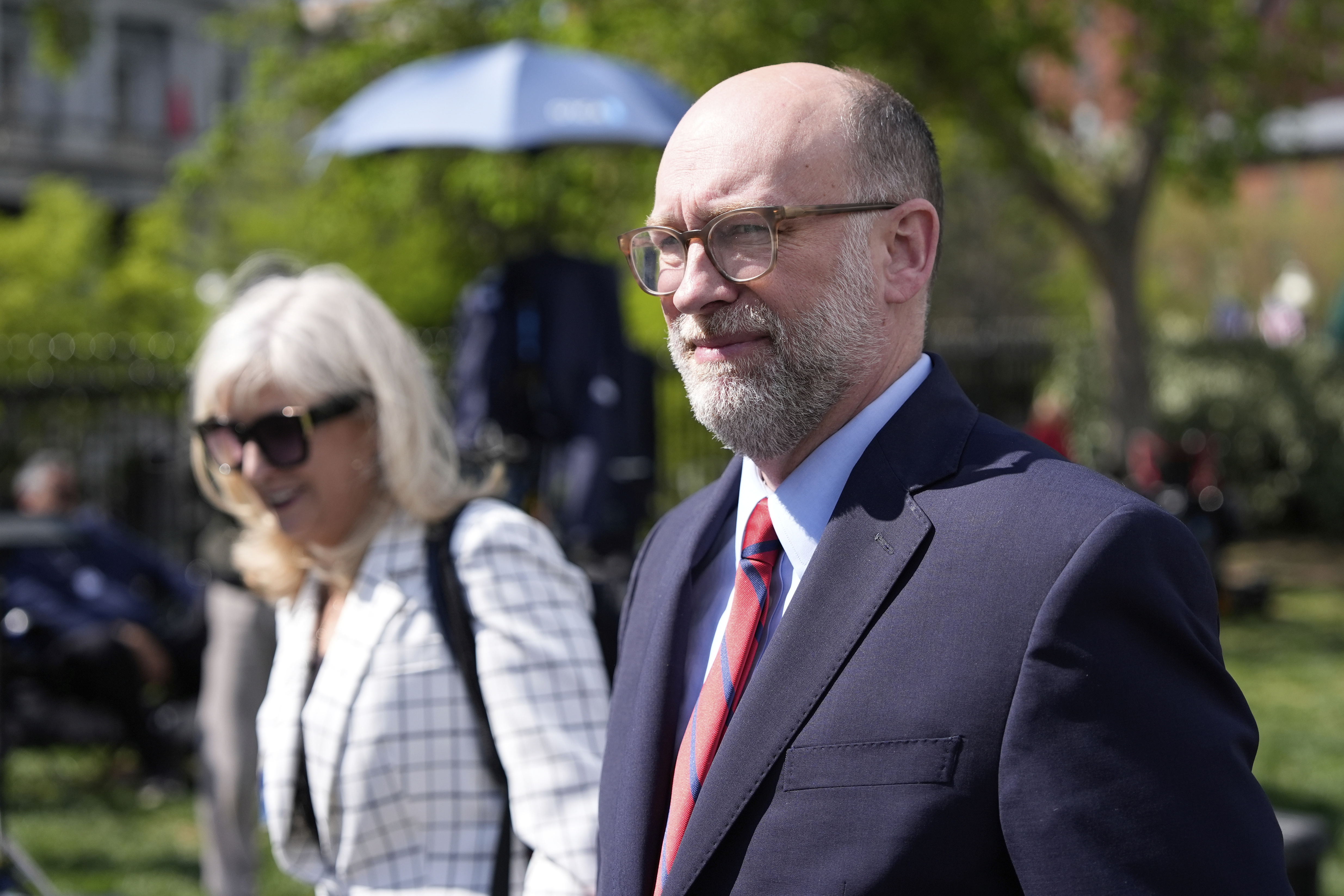 Office of Management and Budget director Russell Vought walks after a television interview at the White House on April 15. (AP Photo/Alex Brandon).