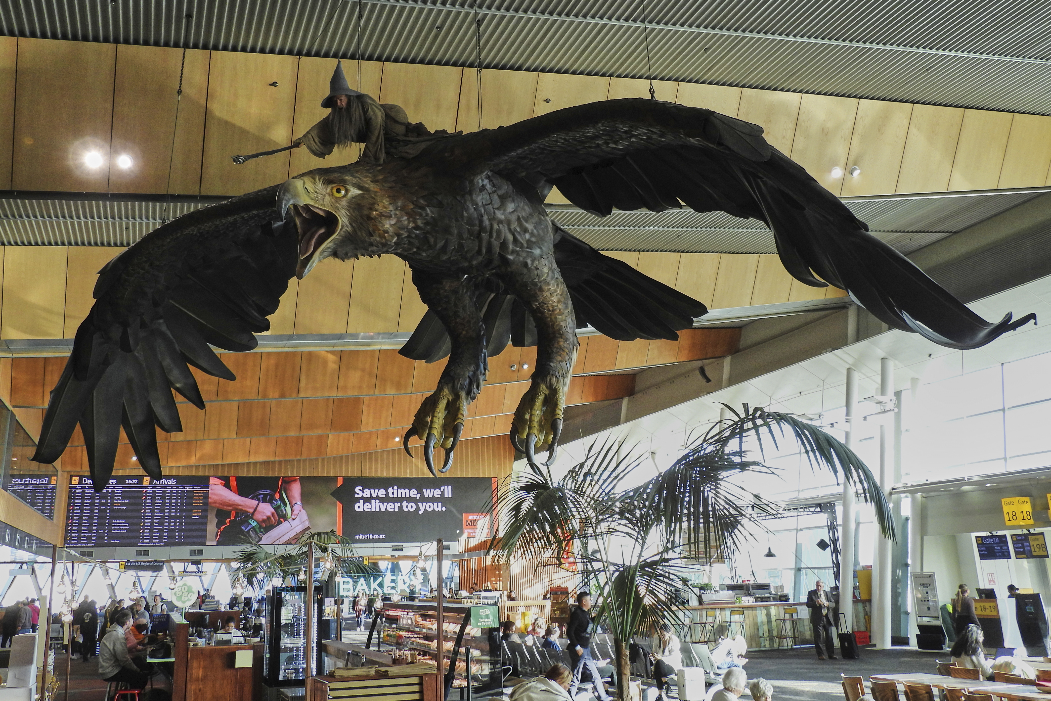 A sculpture of an eagle from the Hobbit films, ridden by the wizard Gandalf, hangs over the food court area of Wellington Airport, in Wellington, New Zealand on Monday. (AP Photo/Charlotte Graham-McLay).