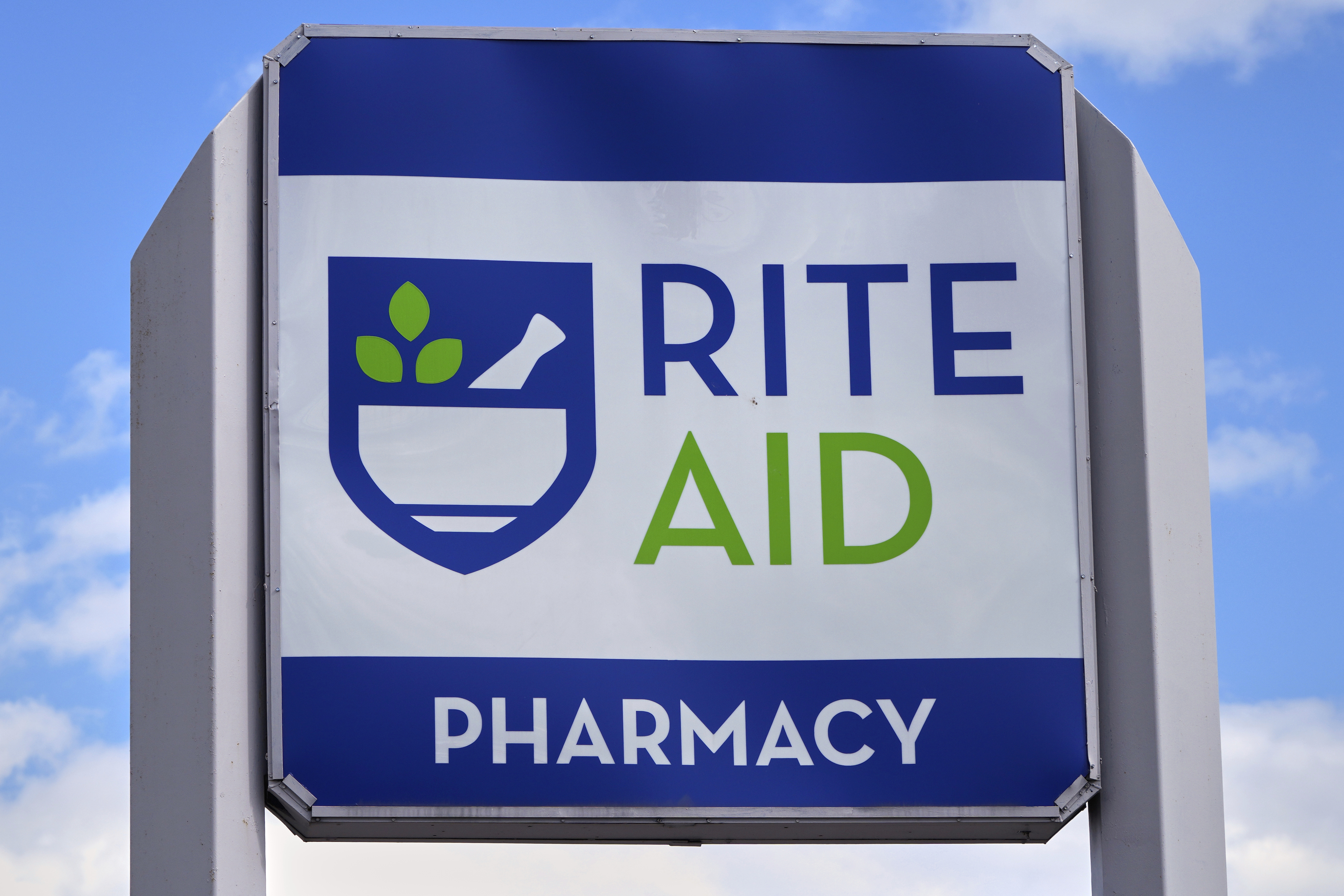 A sign with the company's logo stands outside a Rite Aid store in Salem, N.H., on Wednesday. (AP Photo/Charles Krupa, File).