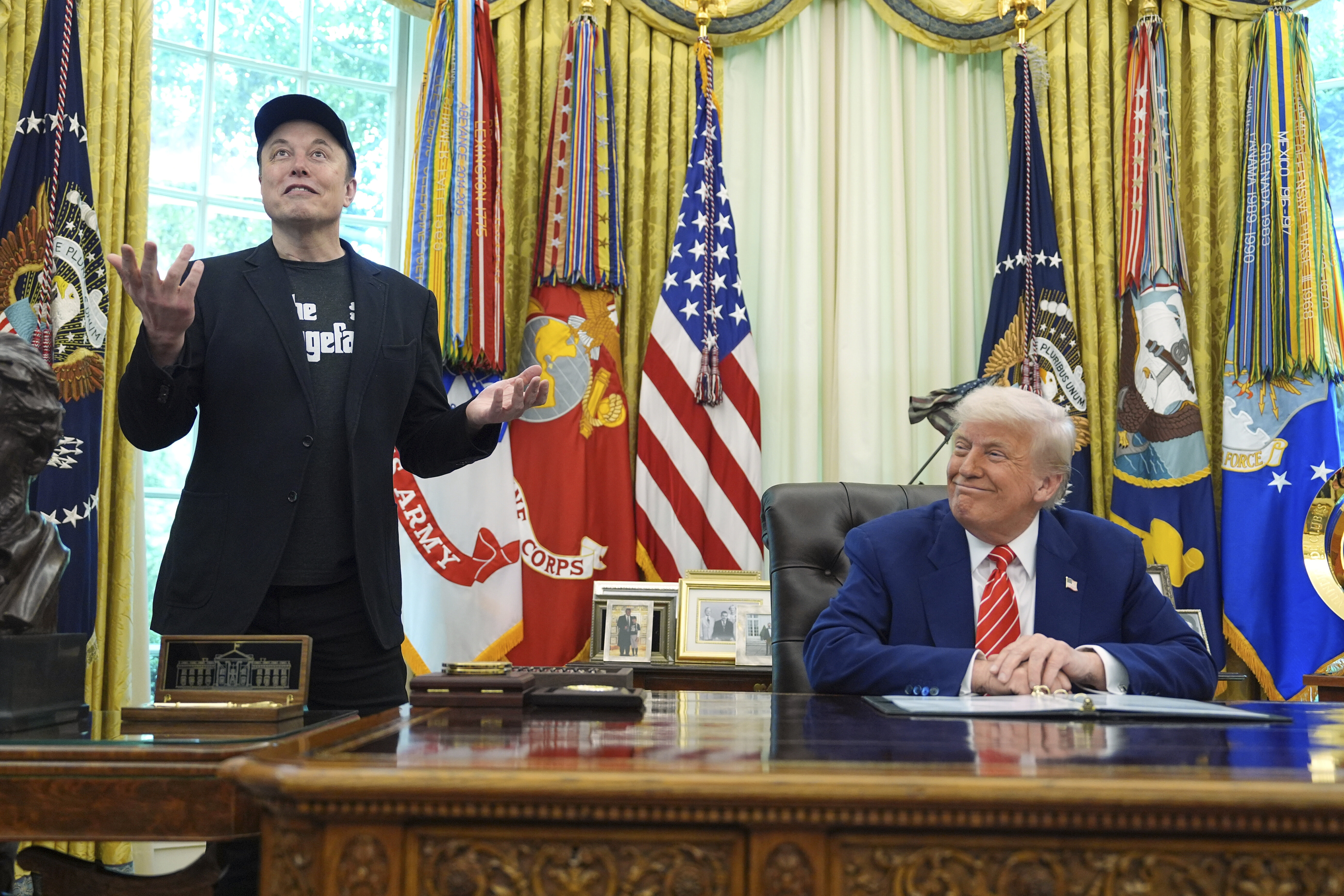 Elon Musk speaks during a news conference with President Donald Trump in the Oval Office of the White House on Friday. (AP Photo/Evan Vucci).