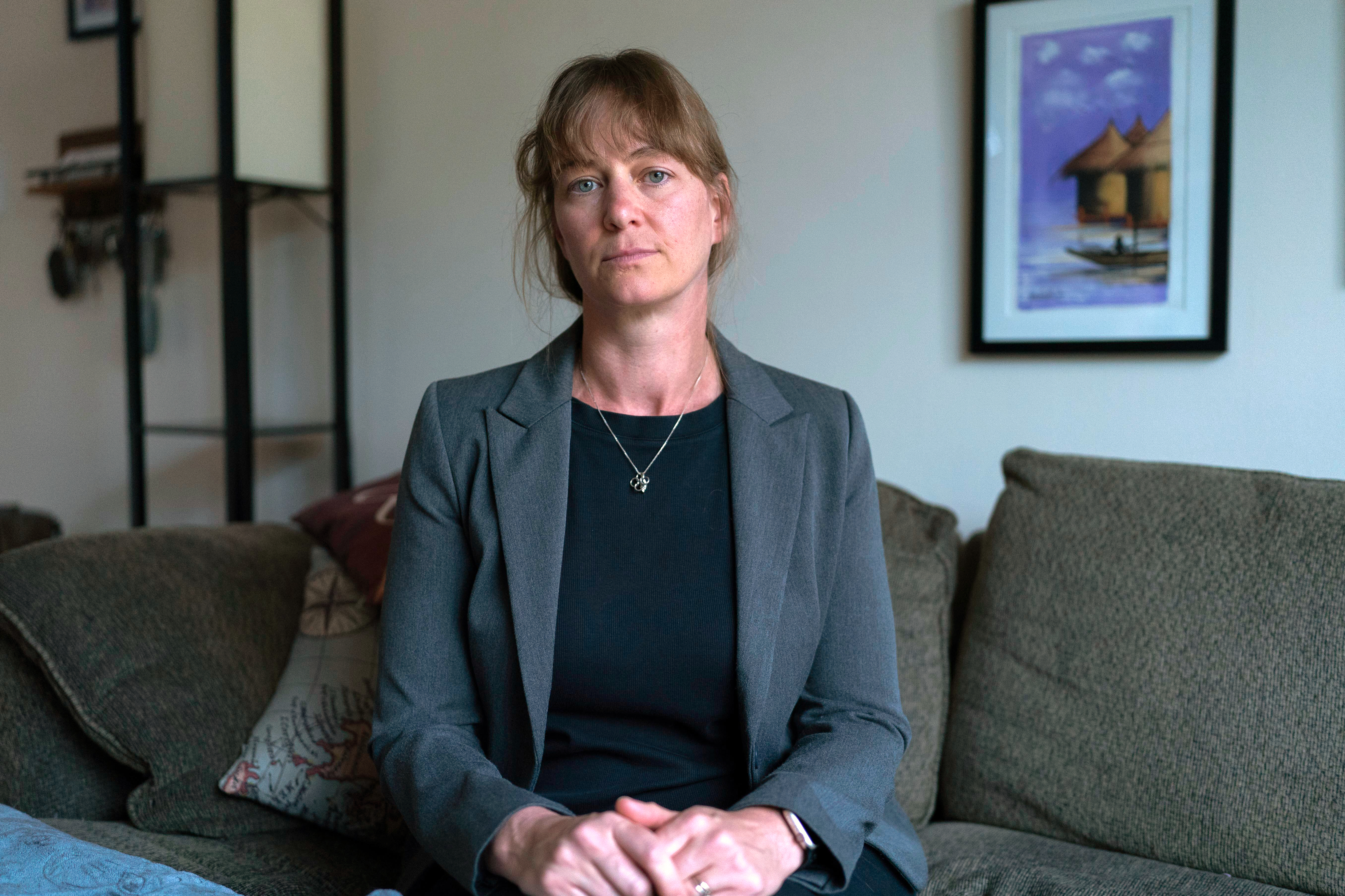 Jenna Norton ,who works as a researcher at the NIH, poses for a photograph during an interview with the Associated Press in Bethesda, Md. on Friday. (AP Photo/Jose Luis Magana).