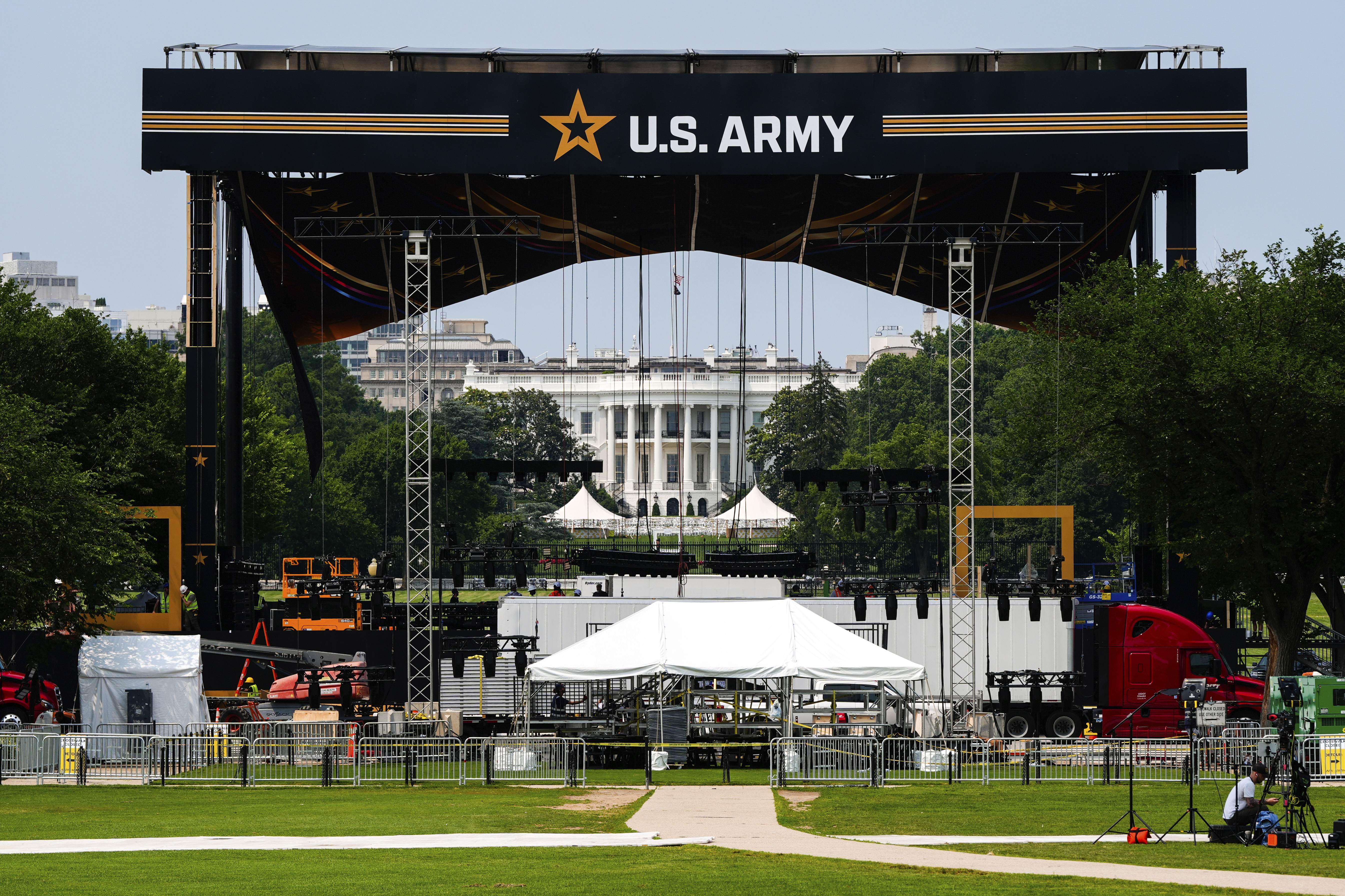 The White House is seen beyond a stage ahead of an upcoming military parade commemorating the Army's 250th anniversary and coinciding with Donald Trump's 79th birthday on Wednesday. (AP Photo/Julia Demaree Nikhinson).
