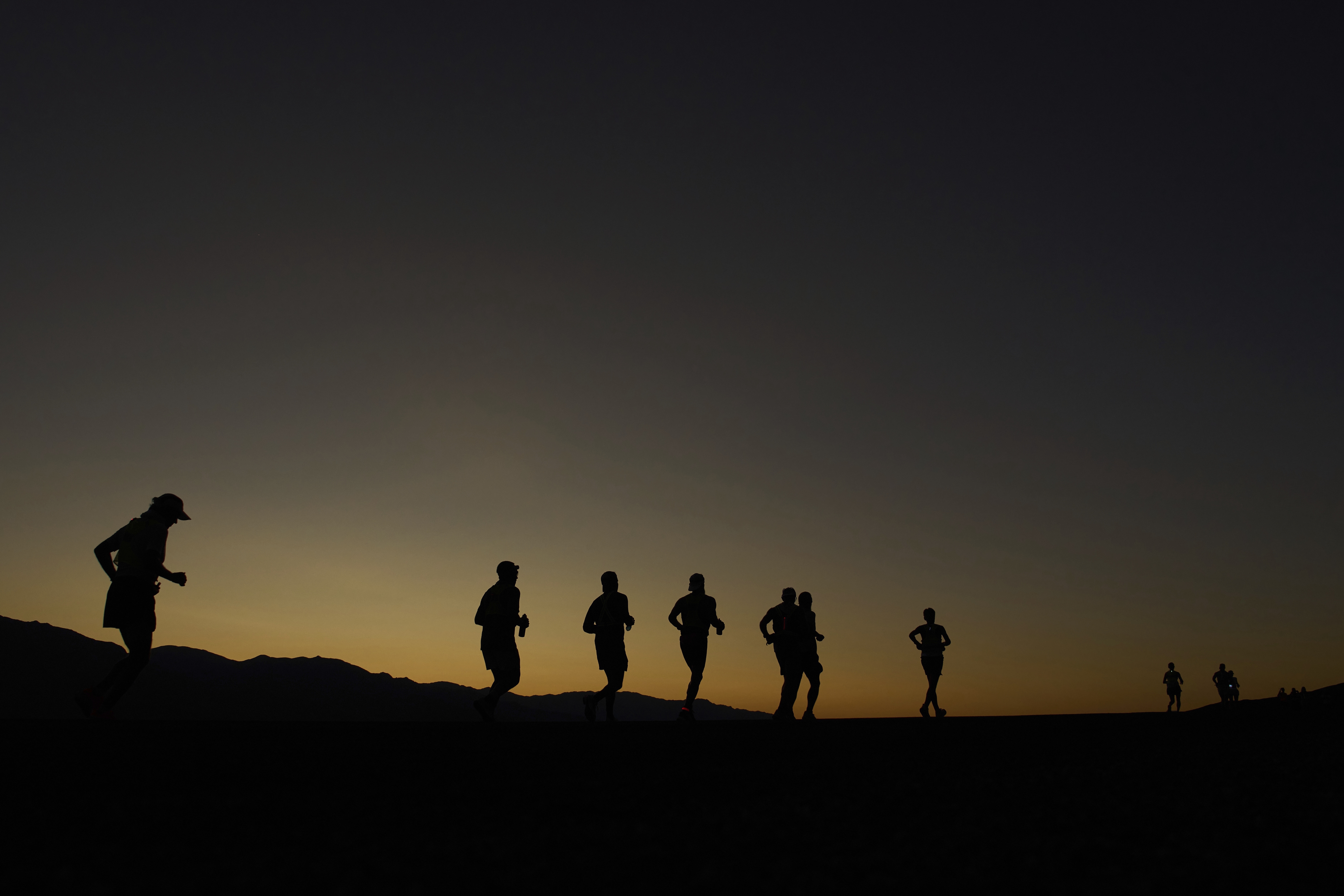 Danny Westergaard, leading the center group of runners, competes during the Badwater 135 Ultramarathon on July 7 near Badwater Basin in Death Valley National Park, Calif. (AP Photo/John Locher).