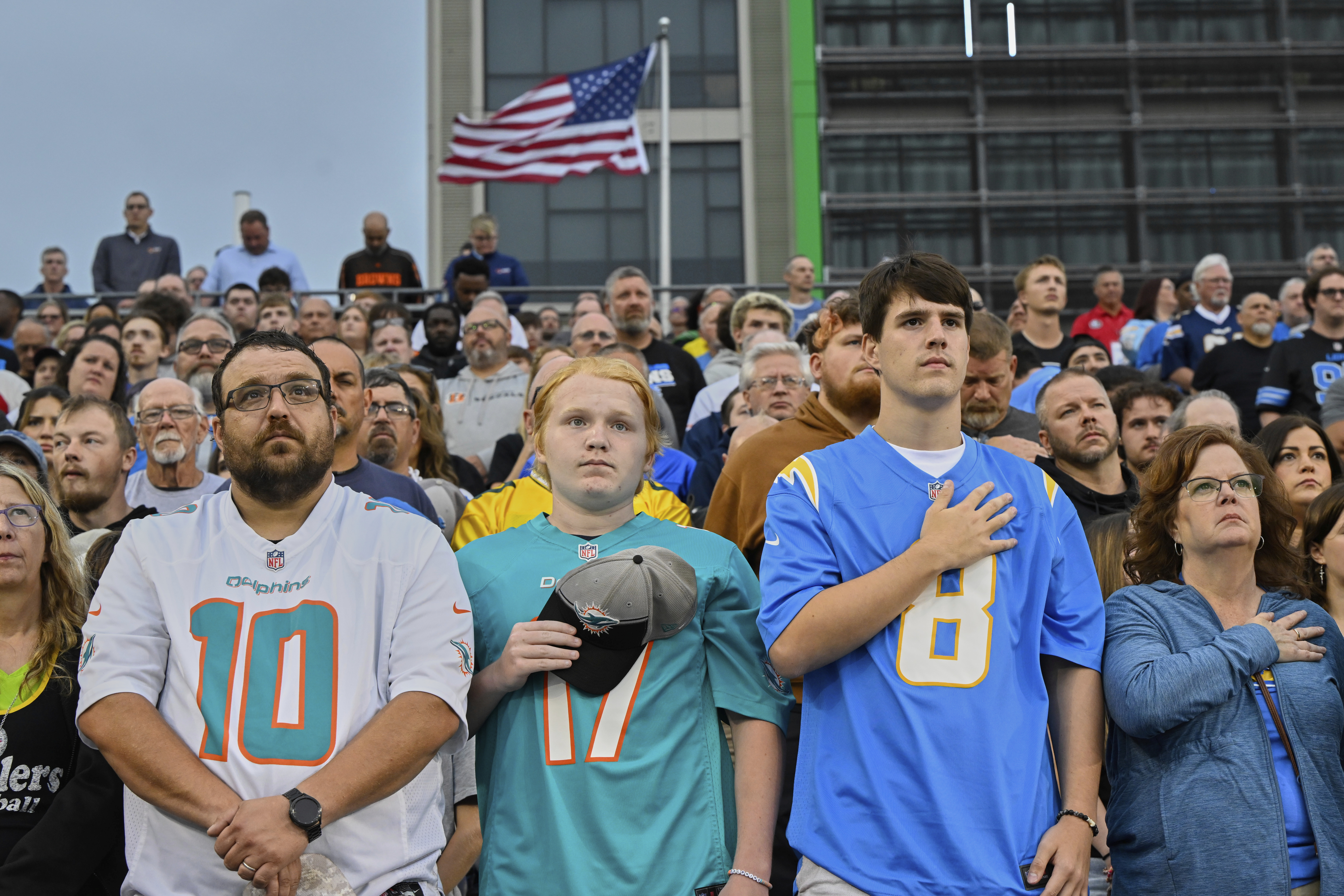 Fans stand for moment of silence before the Pro Football Hall of Fame NFL preseason game between the Los Angeles Chargers and the Detroit Lions on Thursday in Canton, Ohio. (AP Photo/David Richard).