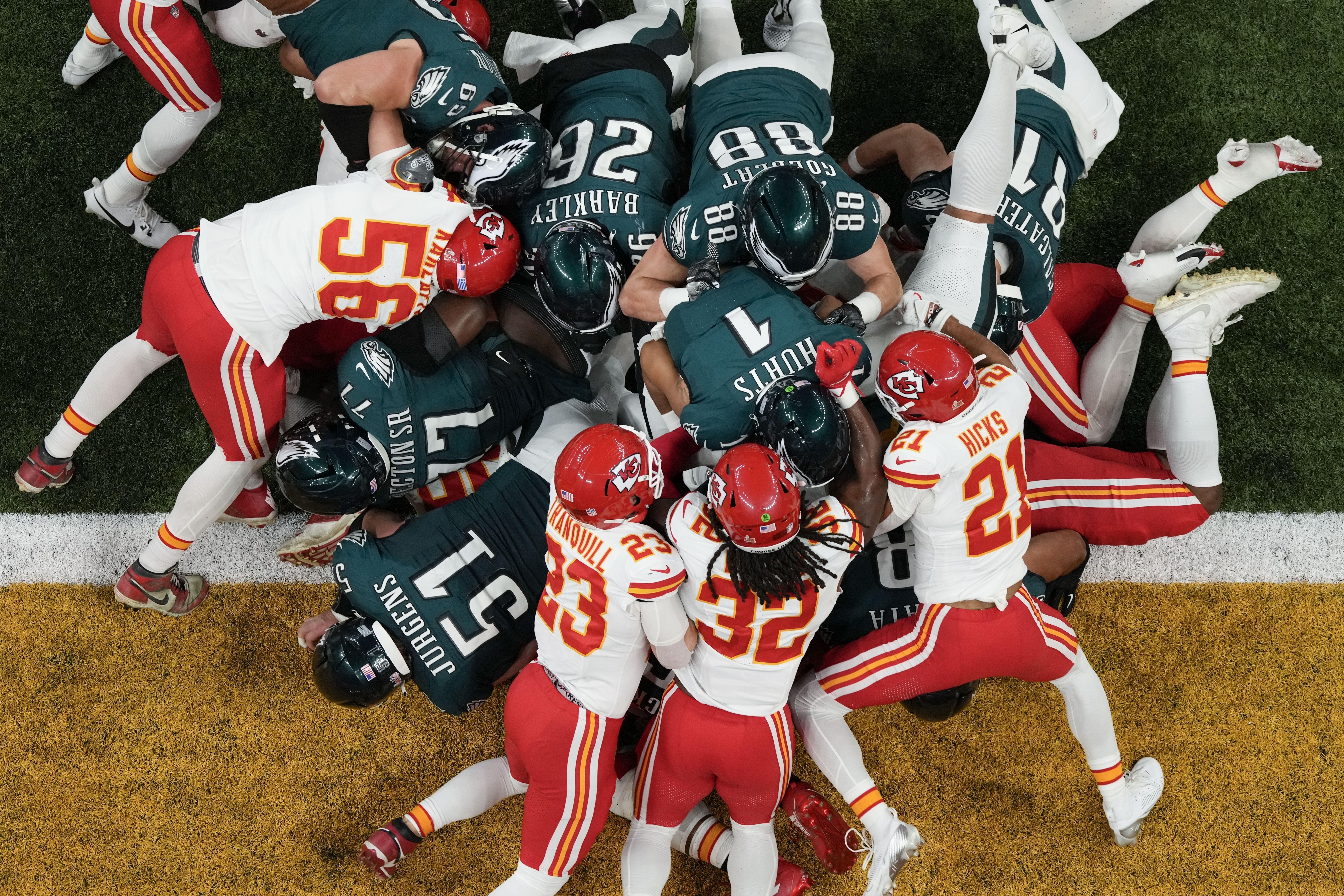 Philadelphia Eagles quarterback Jalen Hurts (1), with help of the tush push from teammates, scores a touchdown against the Kansas City Chiefs during the first half of the NFL Super Bowl 59 football game in February in New Orleans. (AP Photo/Godofredo A. Vásquez).