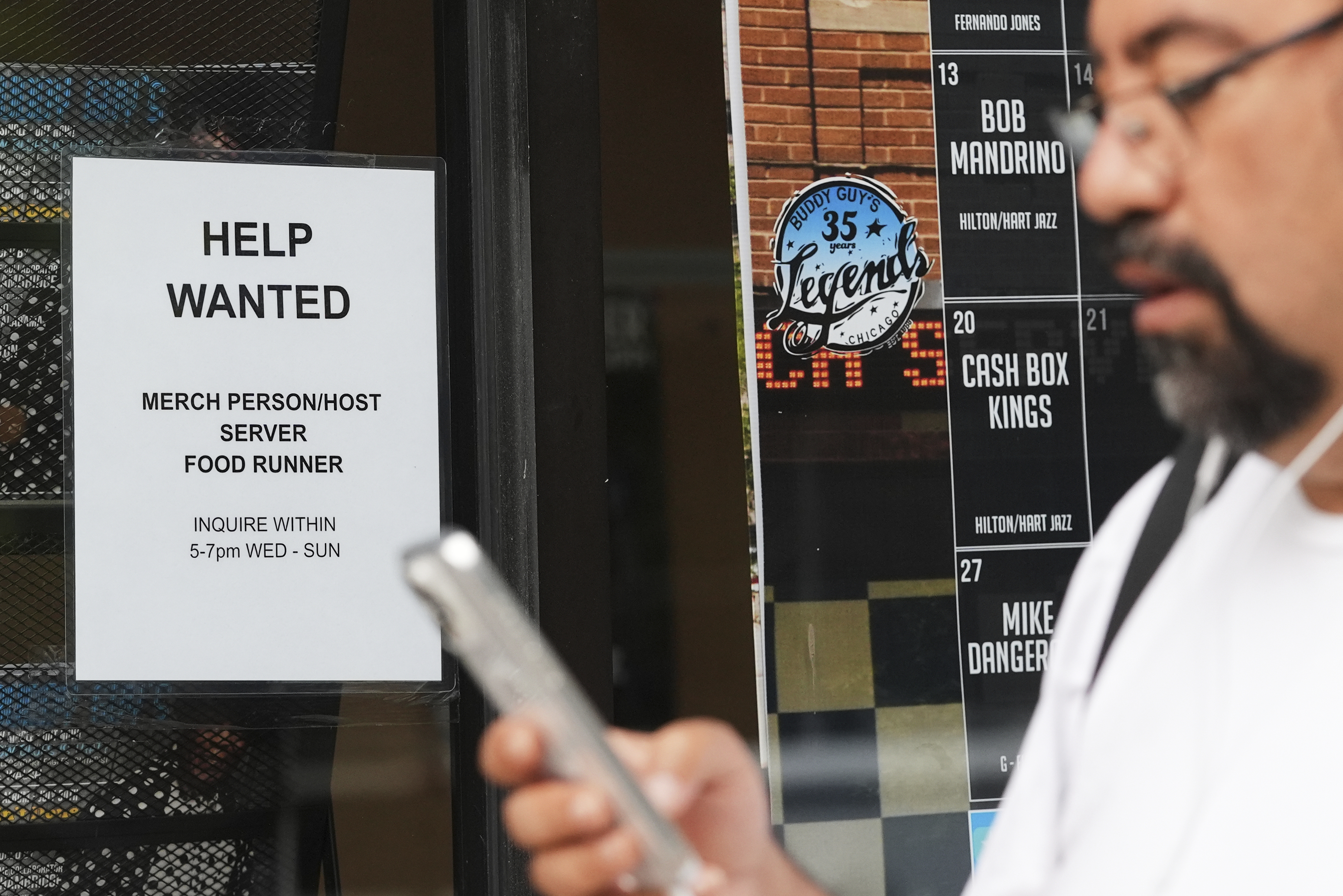 Help wanted sign is displayed at a live music and blues club in Chicago on July 24. (AP Photo/Nam Y. Huh).