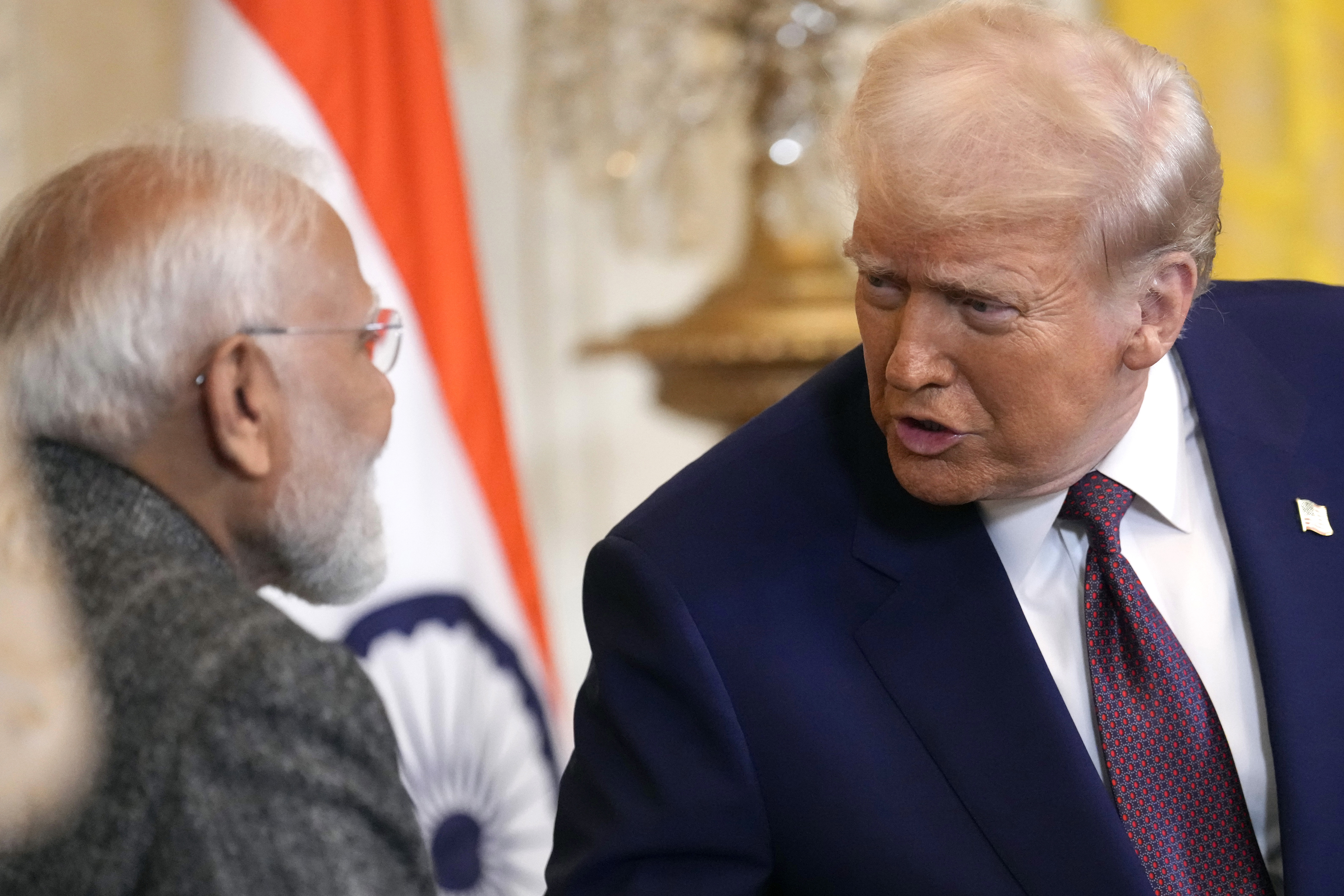 President Donald Trump, right, speaks with India's Prime Minister Narendra Modi during a news conference in the East Room of the White House, Feb. 13, 2025, in Washington. (AP Photo/Ben Curtis, File)
