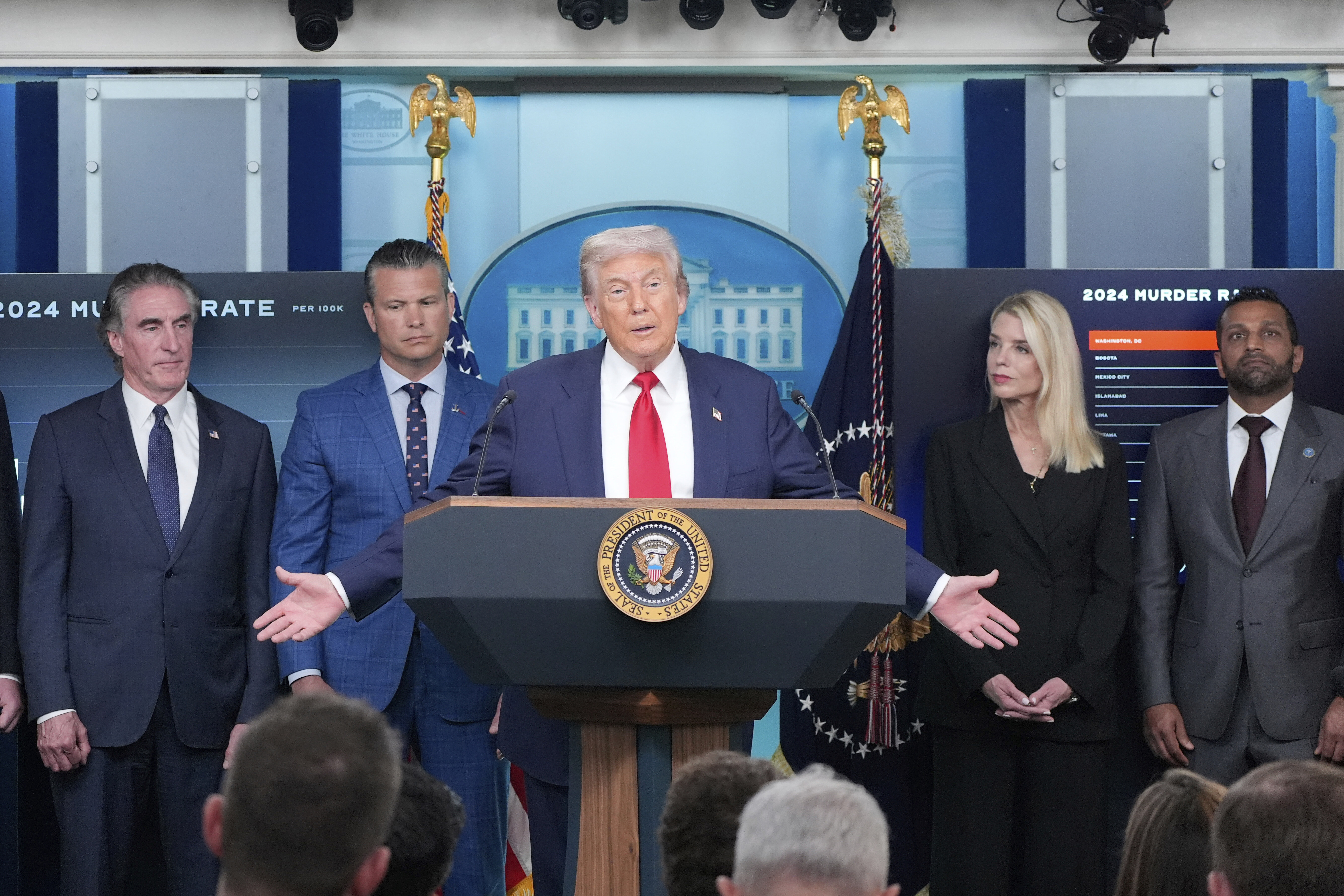 President Donald Trump speaks with reporters in the James Brady Press Briefing Room at the White House, Monday in Washington as from left, Secretary of the Interior Doug Burgum, Secretary of Defense Pete Hegseth, Attorney General Pam Bondi and FBI Director Kash Patel, look on. (AP Photo/Alex Brandon)