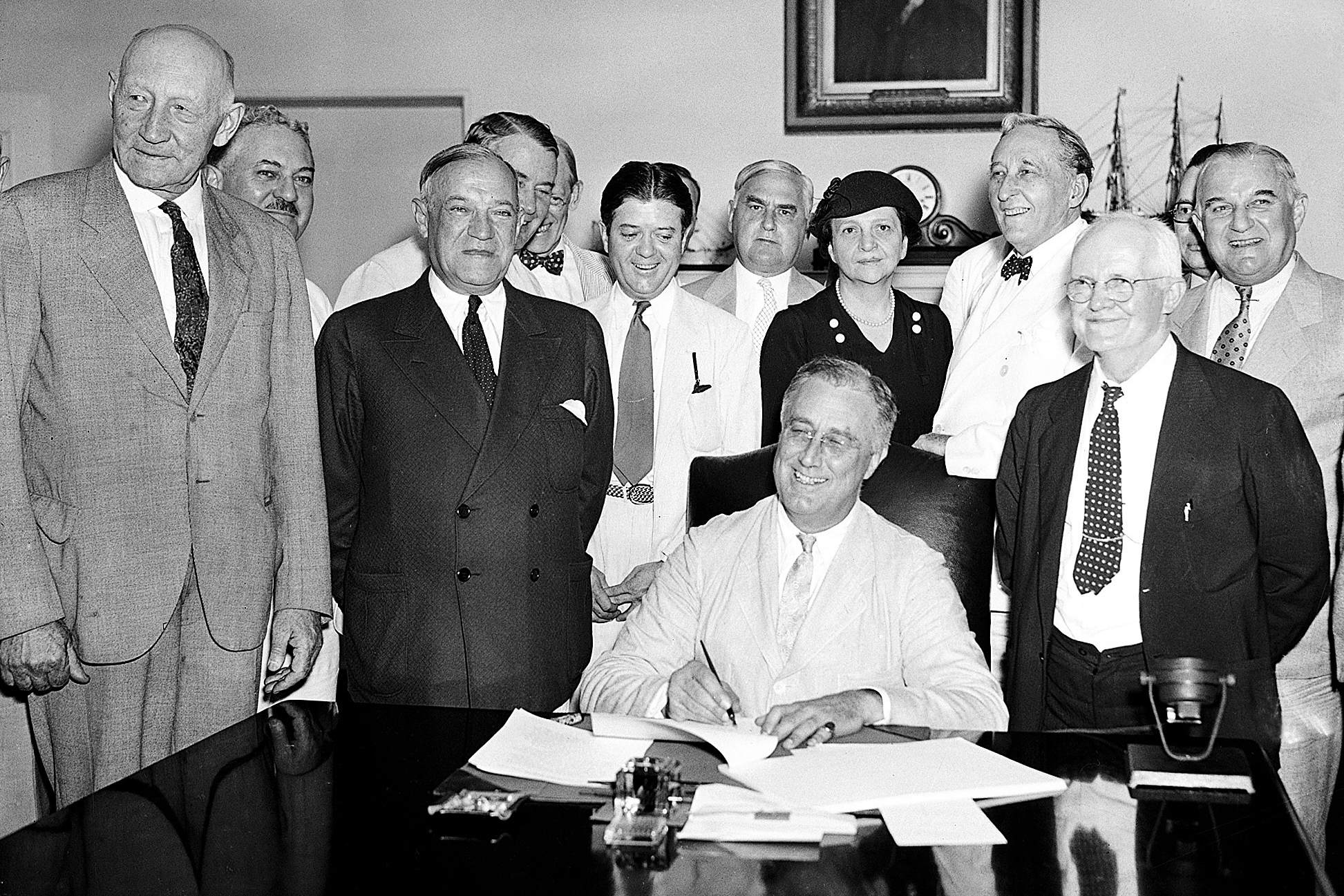 President Franklin Roosevelt signs the Social Security Bill in Washington Aug. 14, 1935. (AP Photo, File)