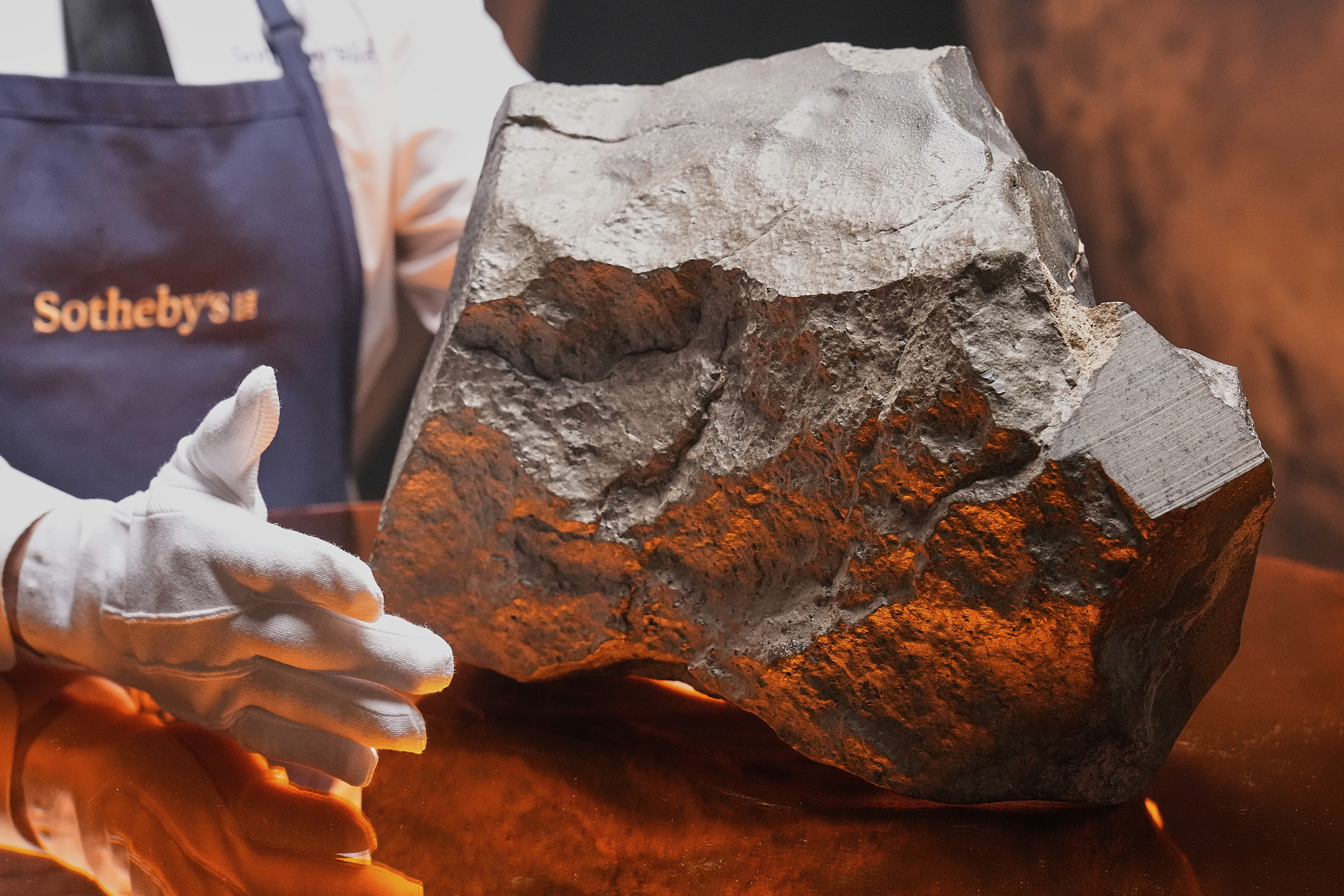 A Martian meteorite, weighing 54.388 lbs., said to be the largest piece of Mars on Earth, at Sotheby's, in New York, in July. (AP Photo/Richard Drew).
