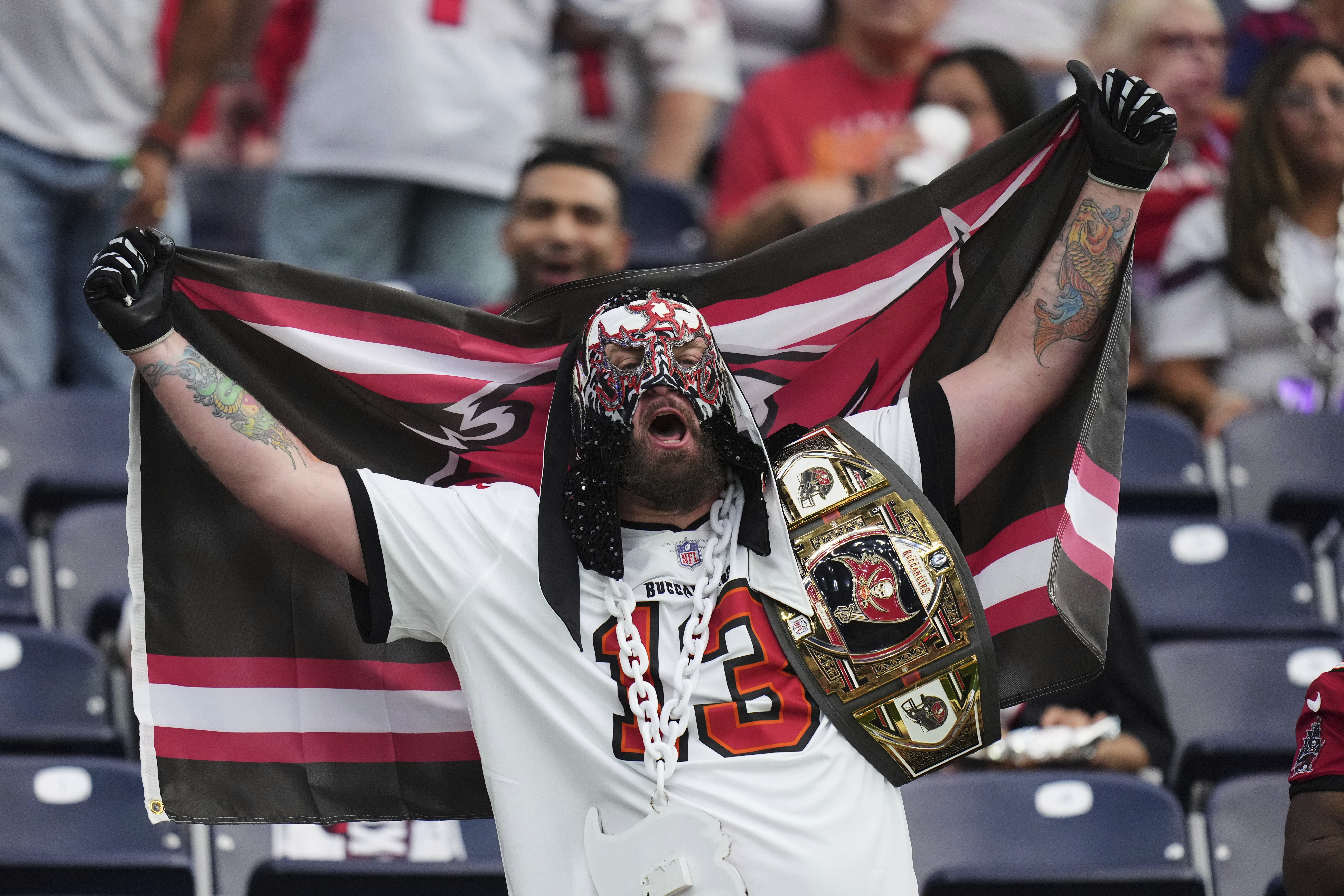 A fan cheers during an NFL football game between the Houston Texans and Tampa Bay Buccaneers Monday, Sept. 15, 2025, in Houston, Texas. (AP Photo/Eric Gay)