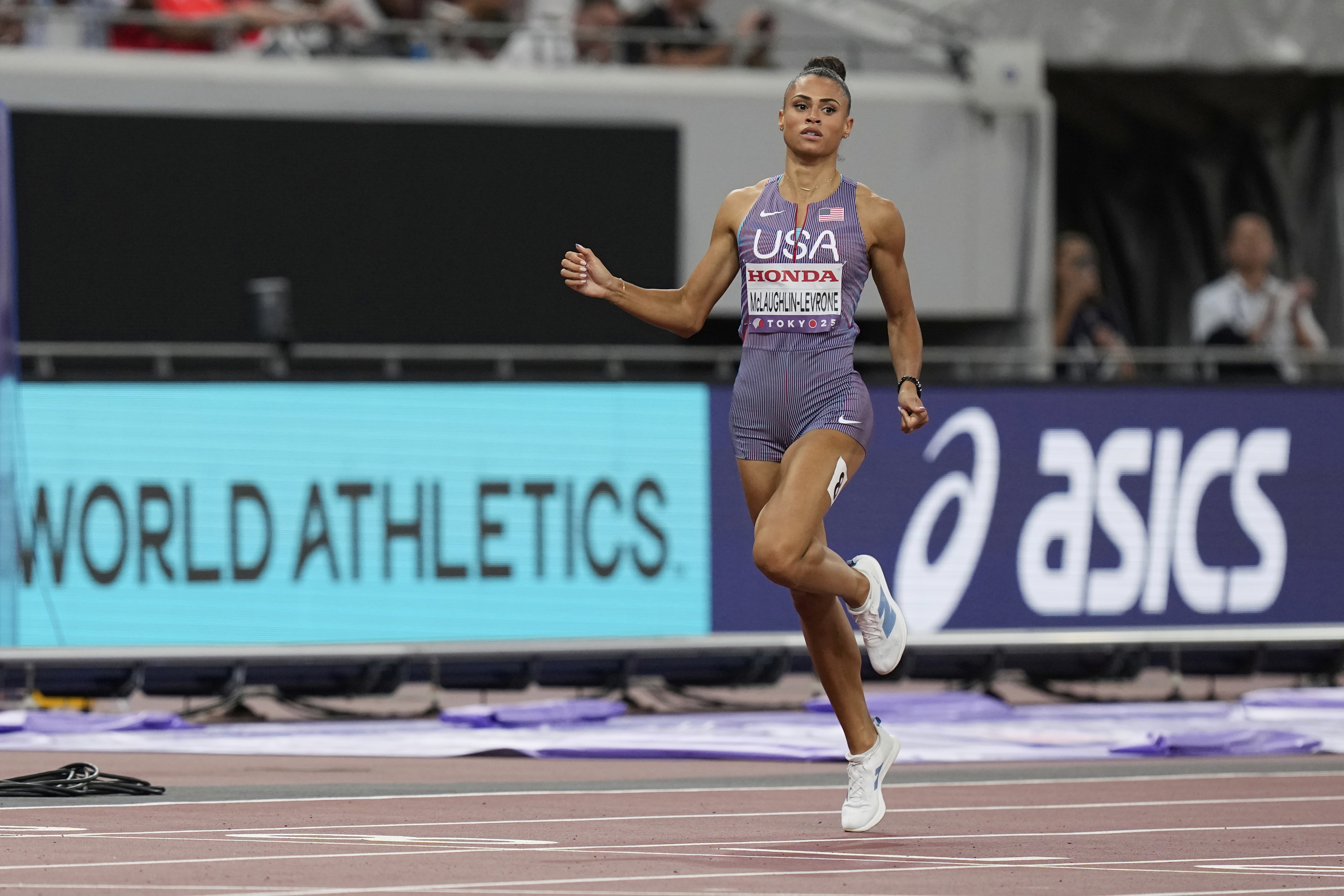 United States' Sydney McLaughlin-Levrone competes in the women's 400 meters semifinal at the World Athletics Championships in Tokyo, Tuesday, Sept. 16, 2025. (AP Photo/Eugene Hoshiko)