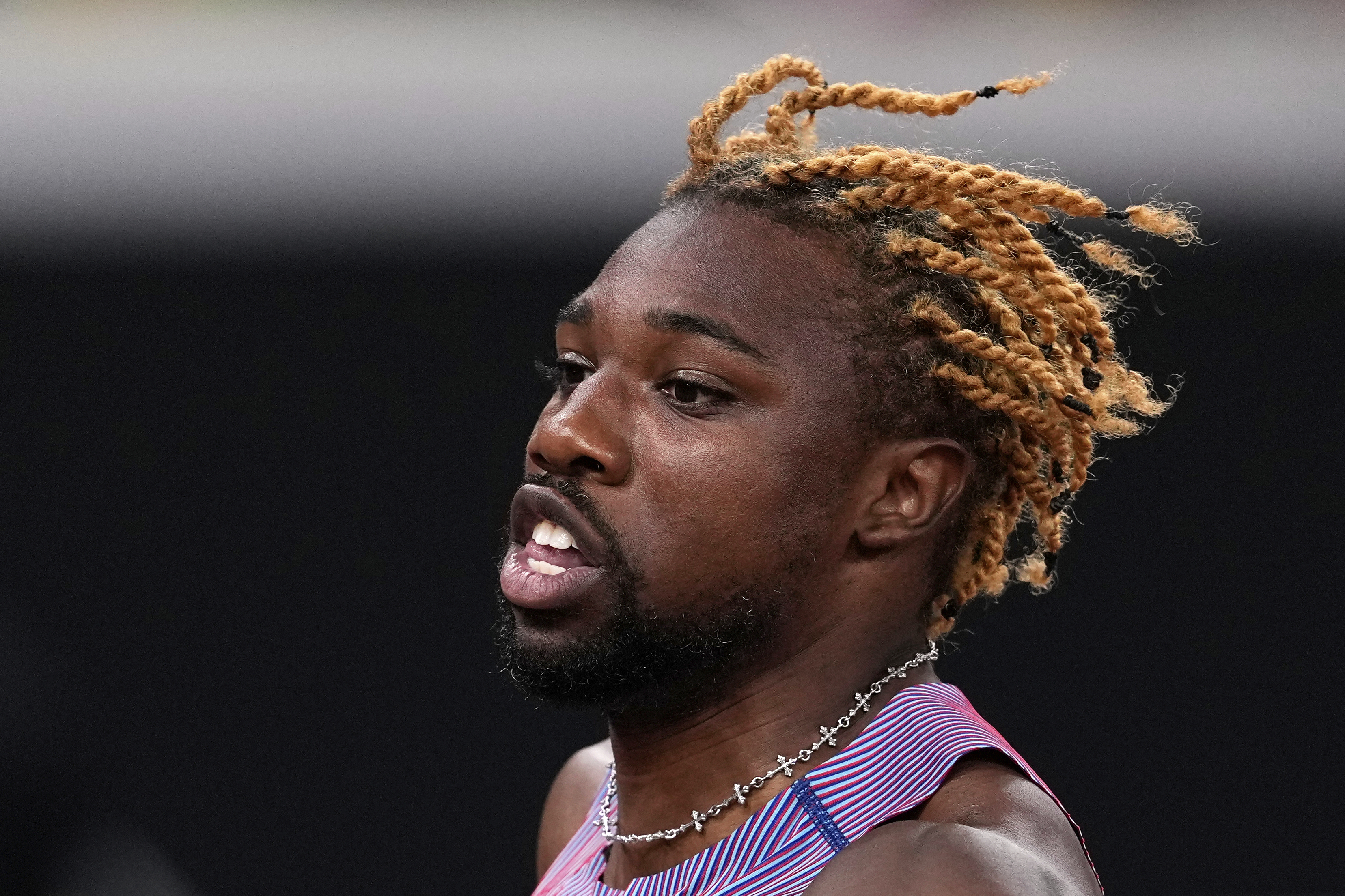 United States' Noah Lyles competes in a men's 100 meters heat at the World Athletics Championships in Tokyo, Saturday, Sept. 13, 2025. (AP Photo/Matthias Schrader)