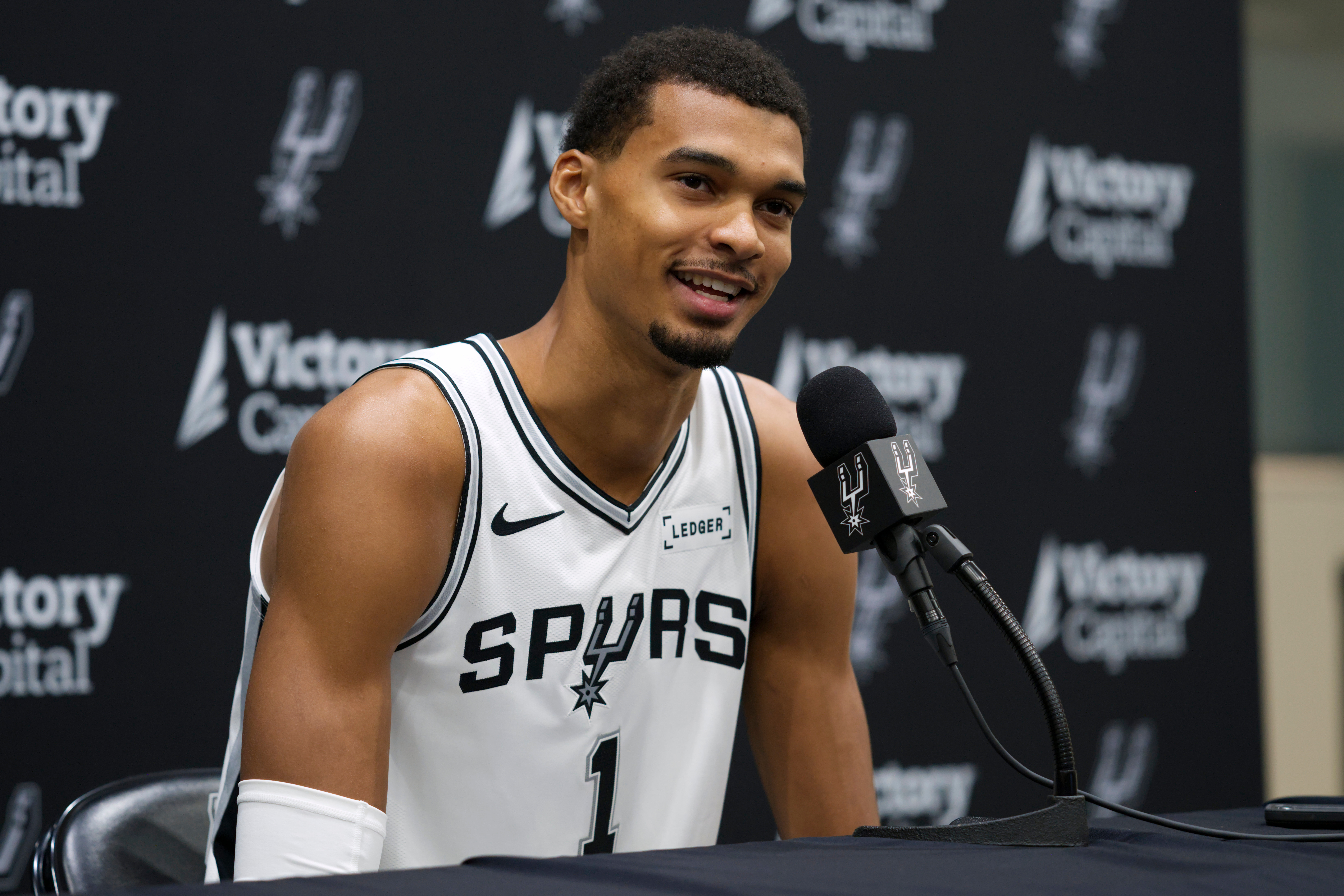 San Antonio Spurs forward Victor Wembanyama speaks to reporters during the NBA basketball team's media day in San Antonio, Monday, Sept. 29, 2025. (AP Photo/Darren Abate)