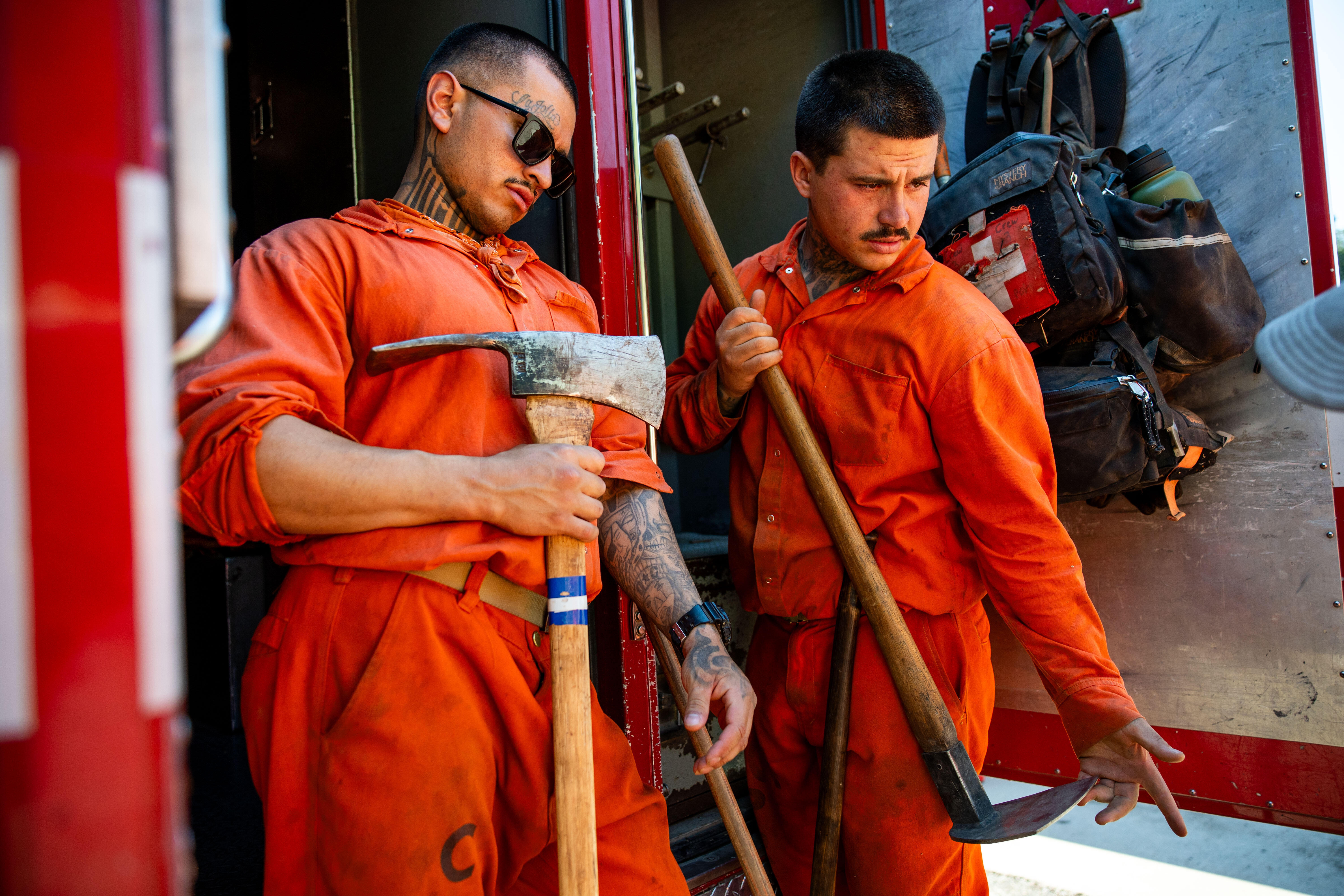 A man unloads tools after work at the Pine Grove Youth Conservation Camp in Calif.