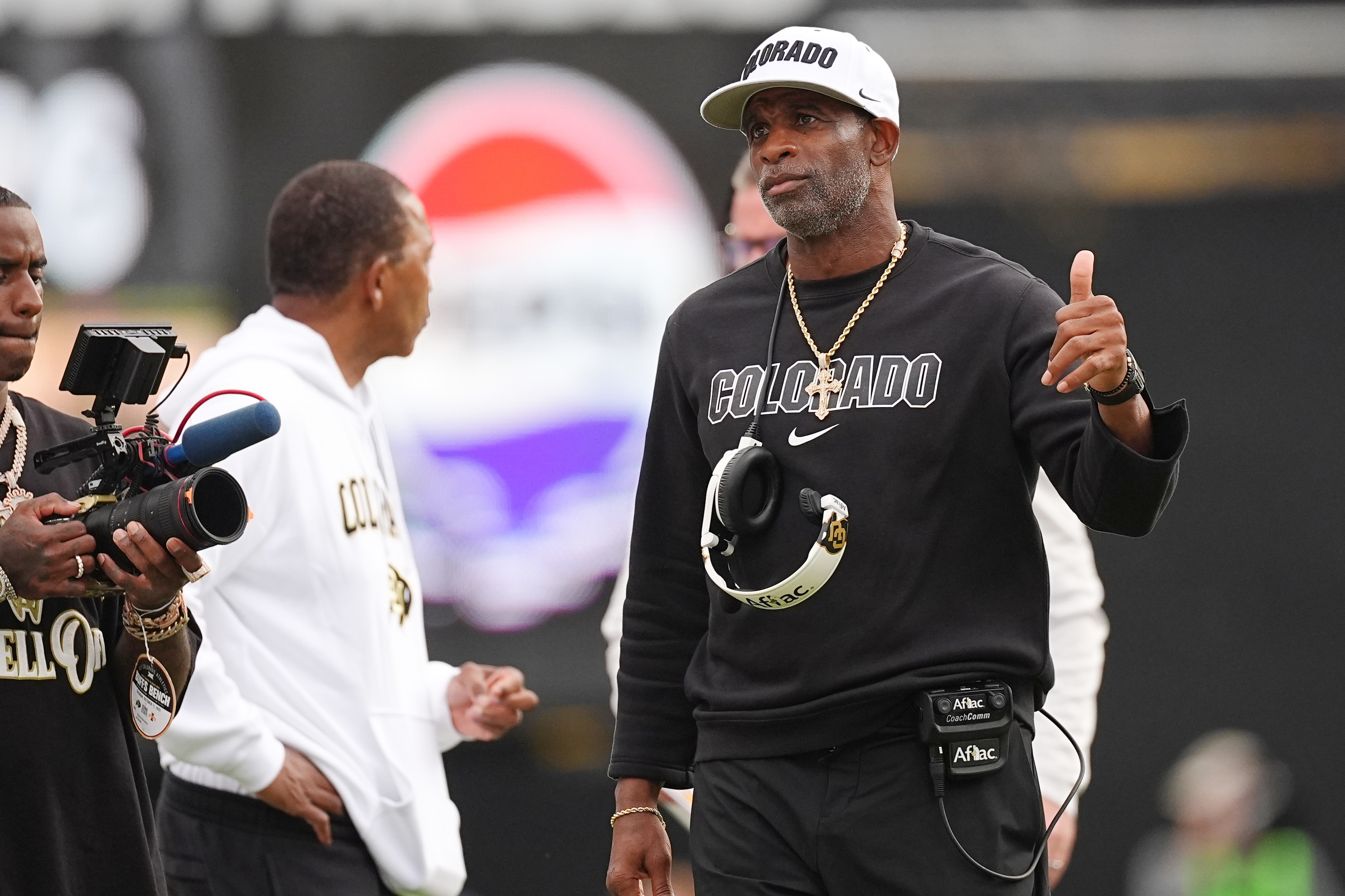 Colorado head coach Deion Sanders gestures to referees after a call against Iowa State in the second half of an NCAA college football game Saturday, Oct. 11, 2025, in Boulder, Colo. (AP Photo/David Zalubowski)