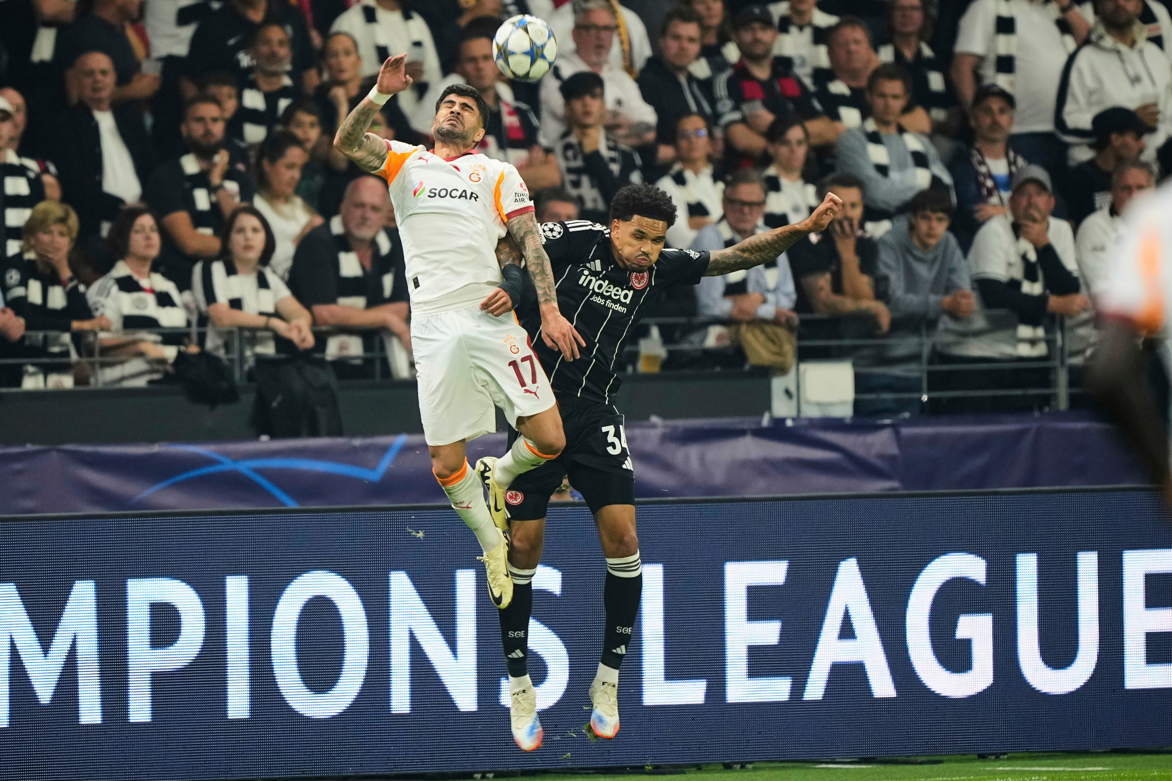 Galatasaray's Eren Elmali, left, and Frankfurt's Nnamdi Collins jump for a header during the Champions League opening phase soccer match between Eintracht Frankfurt and Galatasaray in Frankfurt, Germany, Thursday, Sept. 18, 2025. (AP Photo/Martin Meissner, File)