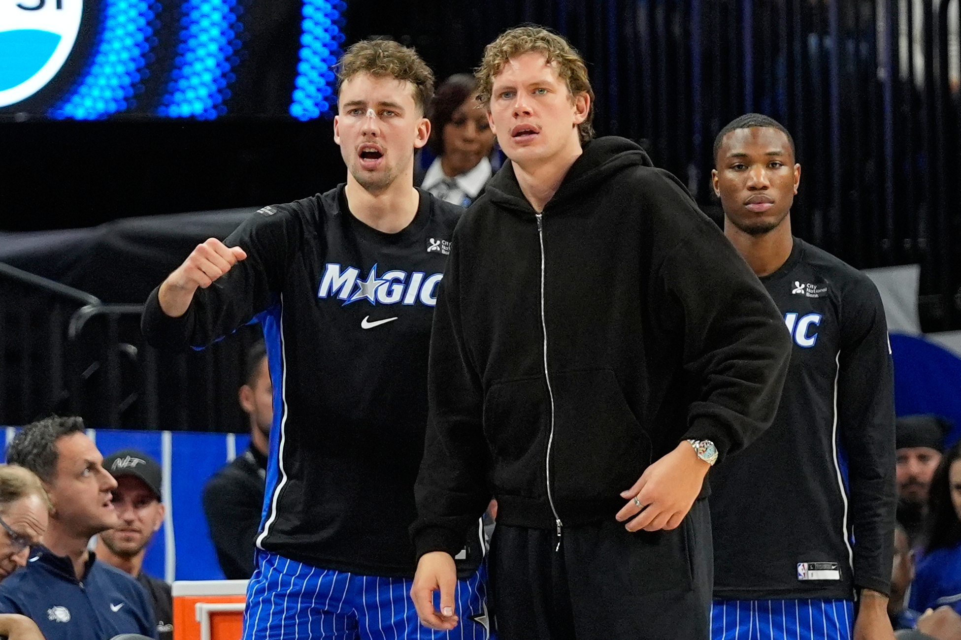 Orlando Magic forward Franz Wagner, left, and brother Moritz Wagner watch the first half of an NBA basketball game against the Golden State Warriors, Tuesday, Nov. 18, 2025, in Orlando, Fla.