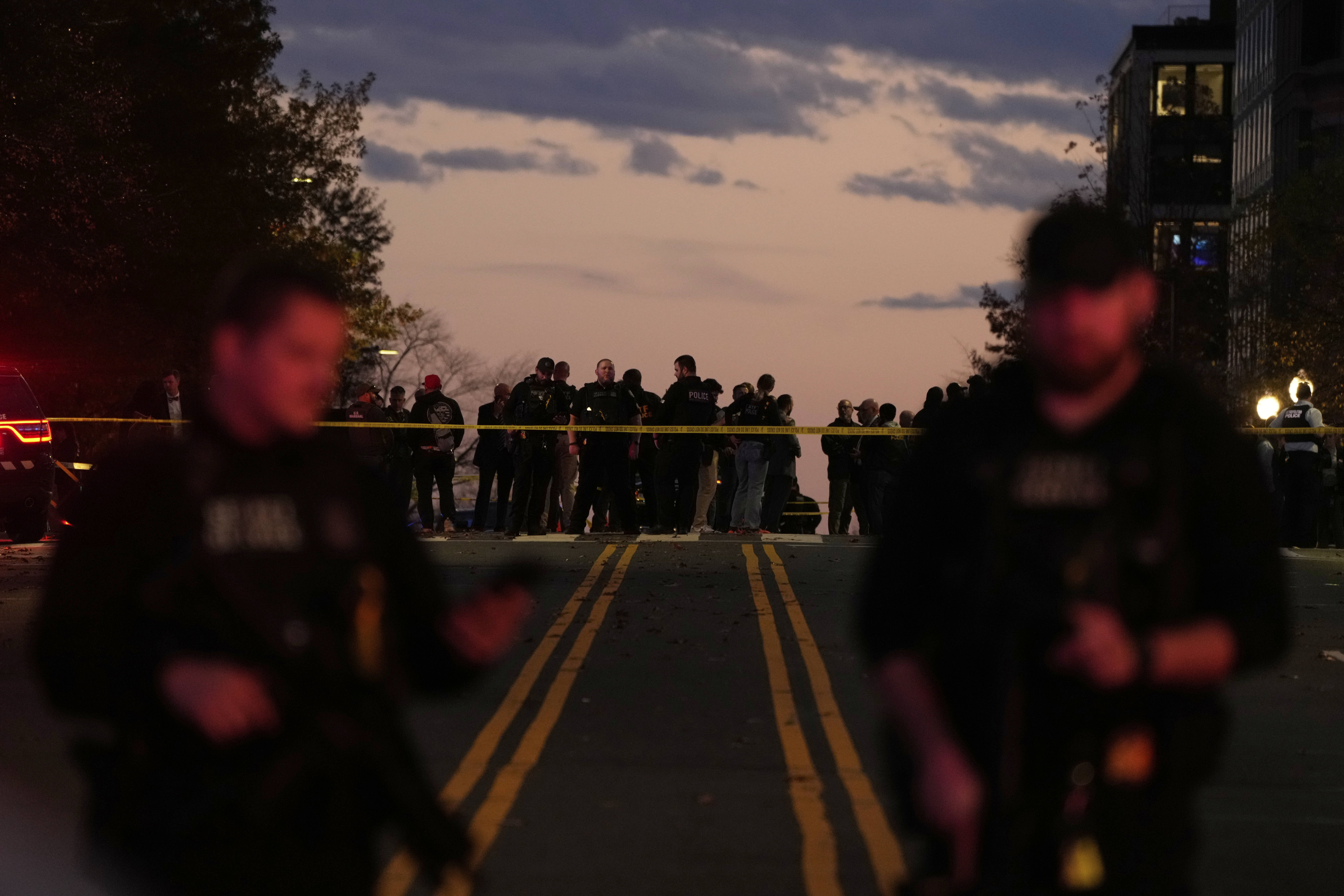 Emergency personnel keep a presence following the shooting of two National Guard soldiers near the White House in Washington.