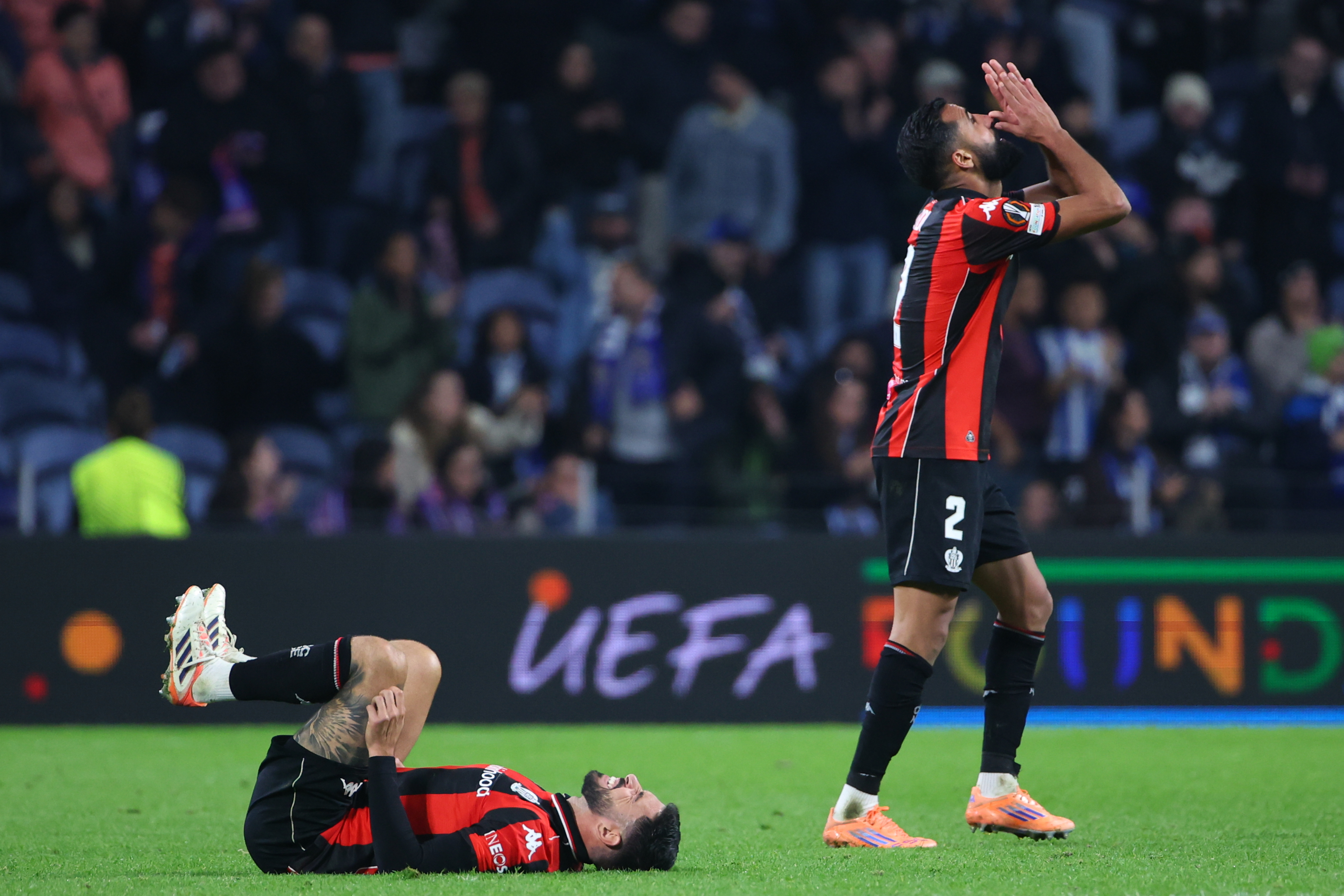 Nice's Morgan Sanson, left, and Ali Abdi react at the the end of the Europa League opening phase soccer match between FC Porto and Nice in Porto, Portugal, Thursday, Nov. 27, 2025. (AP Photo/Luis Vieira)