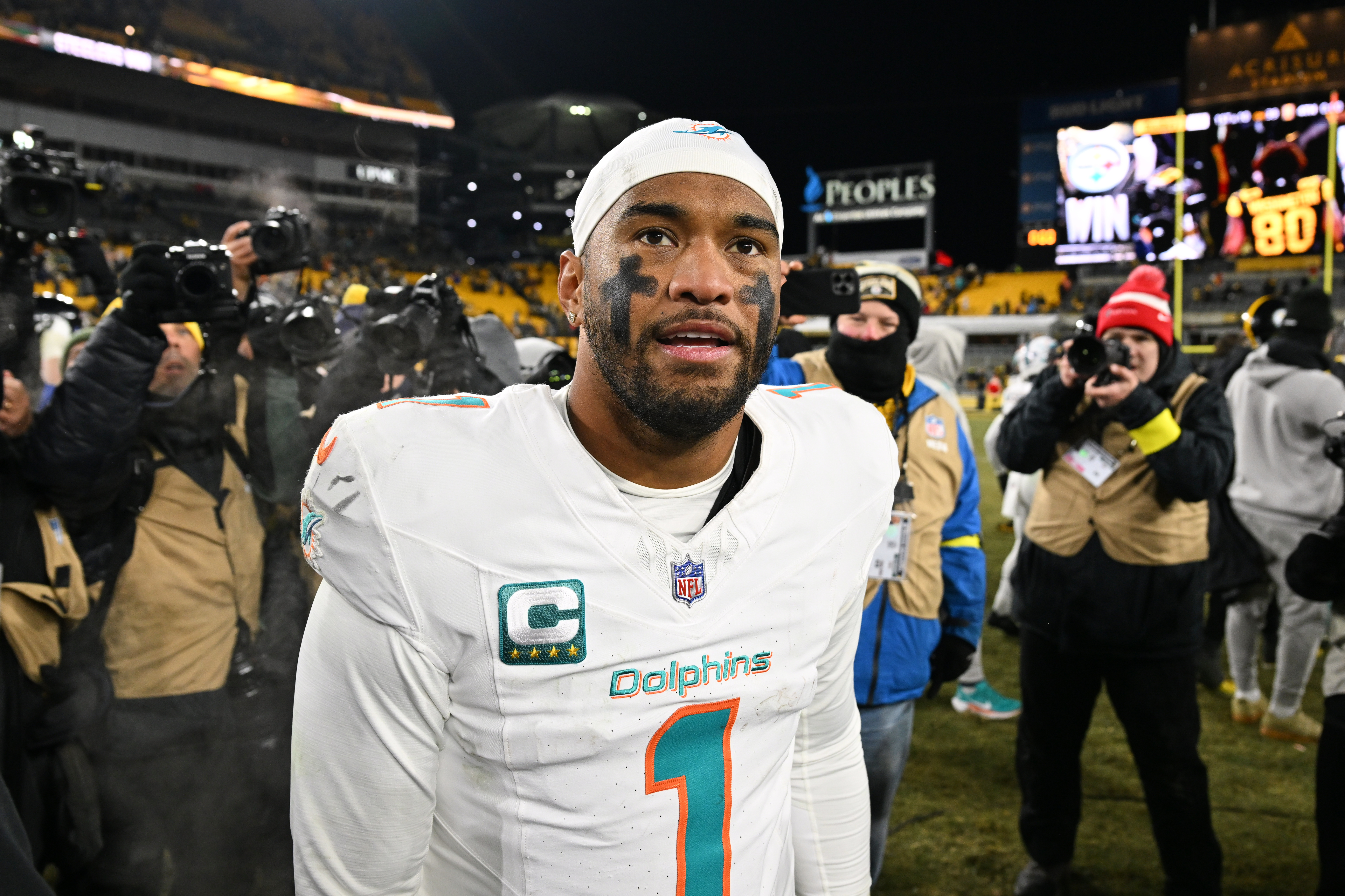 Miami Dolphins quarterback Tua Tagovailoa (1) walks off the field after an NFL football game against the Pittsburgh Steelers in Pittsburgh, Monday, Dec. 15, 2025. (AP Photo/Justin Berl)