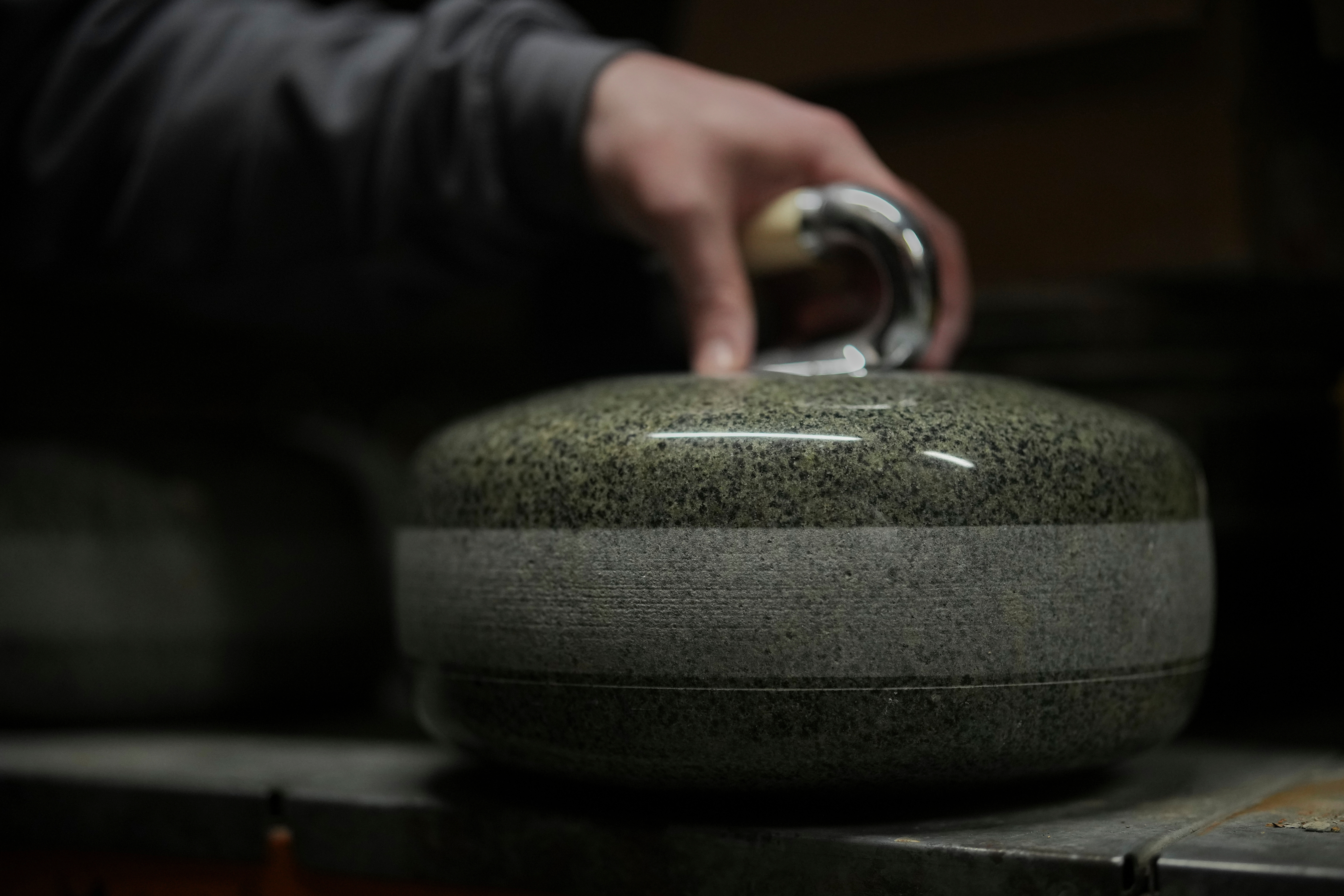 A finished curling stone sits in a store room at Kays Curling stone factory in Mauchline, Scotland, Tuesday, Nov. 11, 2025. (AP Photo/Alastair Grant)