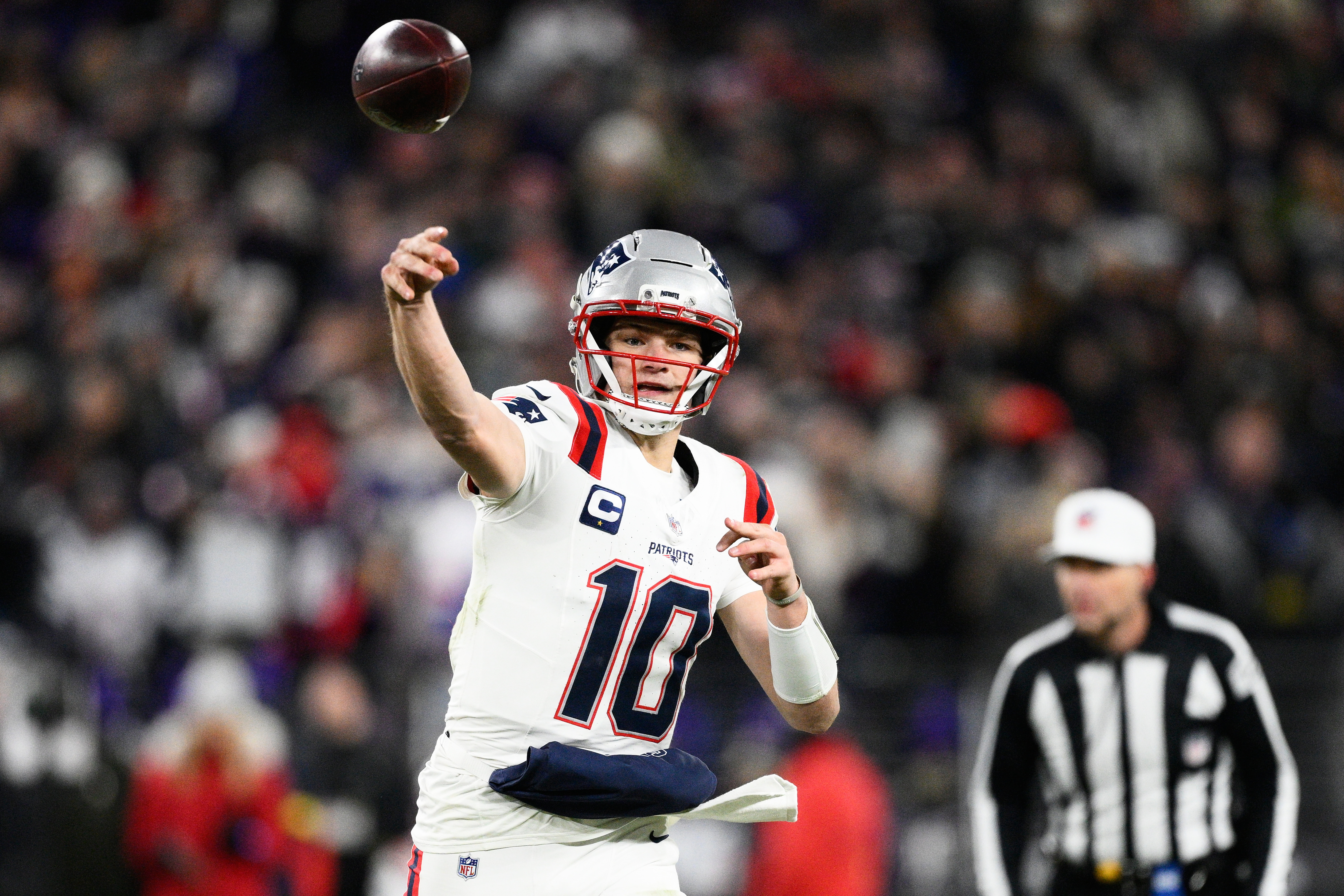 New England Patriots quarterback Drake Maye (10) passes against the Baltimore Ravens during the first half of an NFL football game, Sunday, Dec. 21, 2025, in Baltimore.