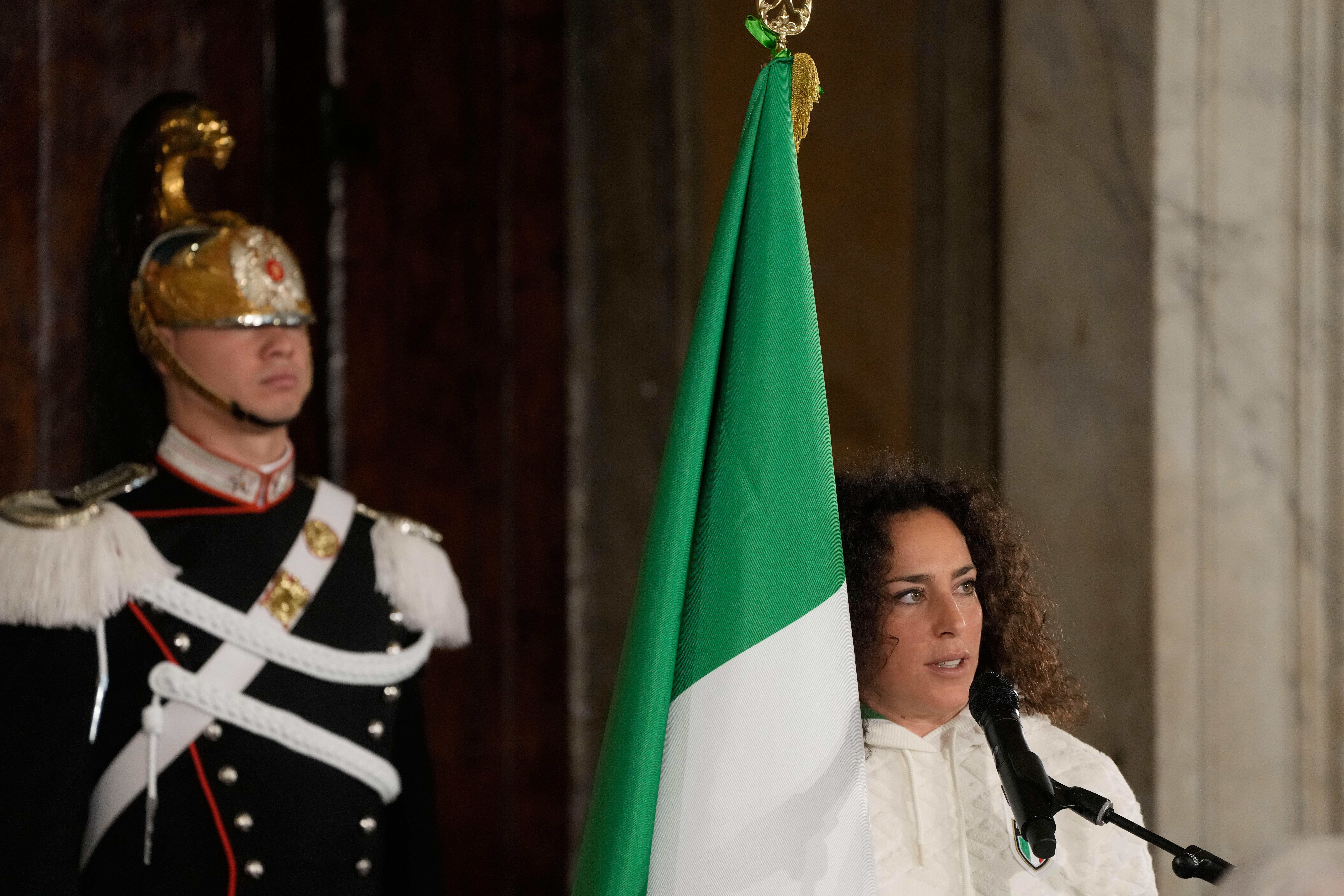 Italy's Federica Brignone delivers her speech during the hand over ceremony of the Italian flag by the Italian President Sergio Mattarella for the Milan-Cortina Winter Olympic games, at the Quirinale Presidential palace, in Rome, Monday, Dec. 22, 2025.