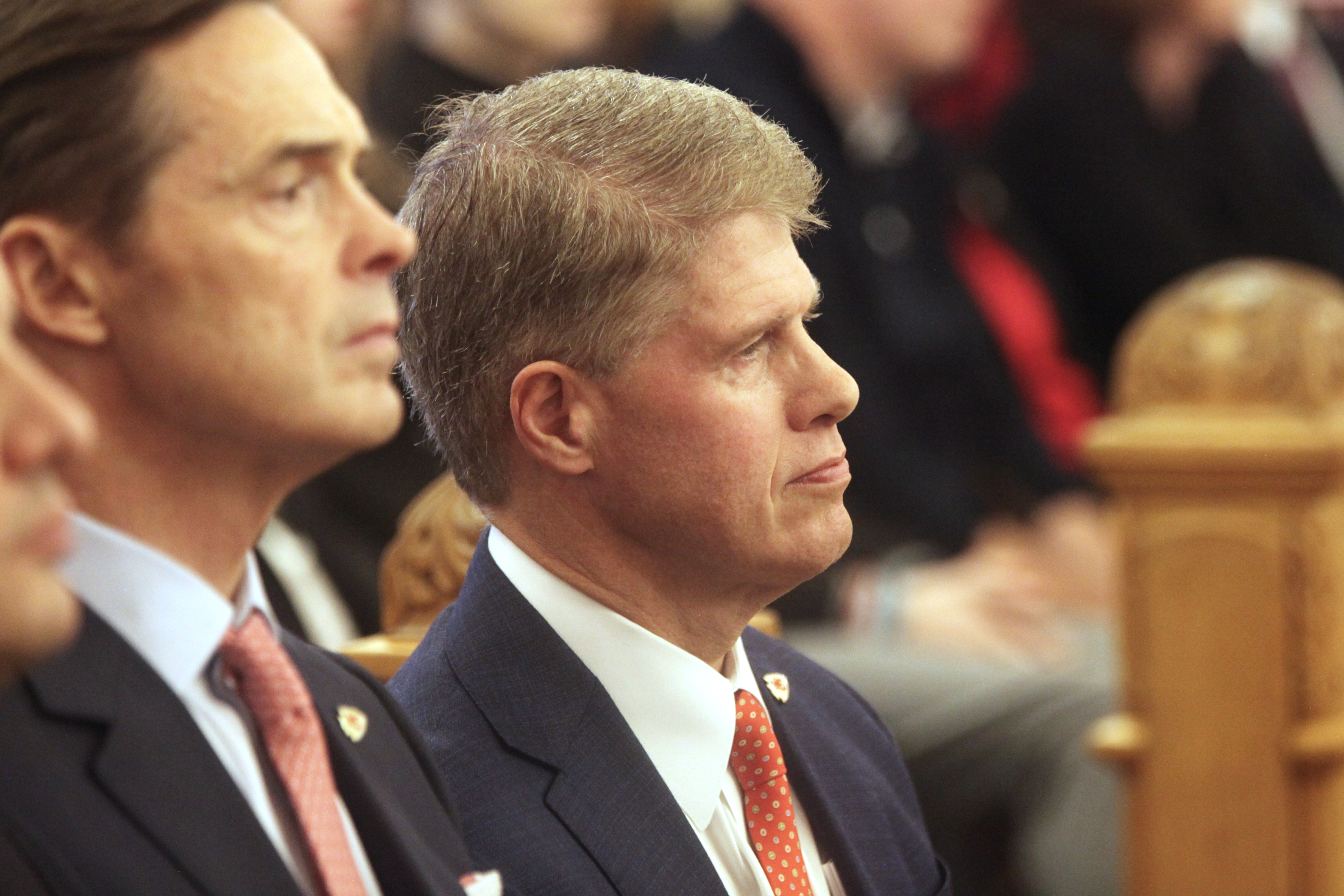 Kansas City Chiefs Chairman and CEO Clark Hunt watches the start of a meeting of legislative leaders who had the power to decide whether the state issues bonds to help the Chiefs finance a new stadium on the Kansas side of the Kansas City metropolitan area, Monday, Dec. 22, 2025, at the Statehouse in Topeka, Kan.