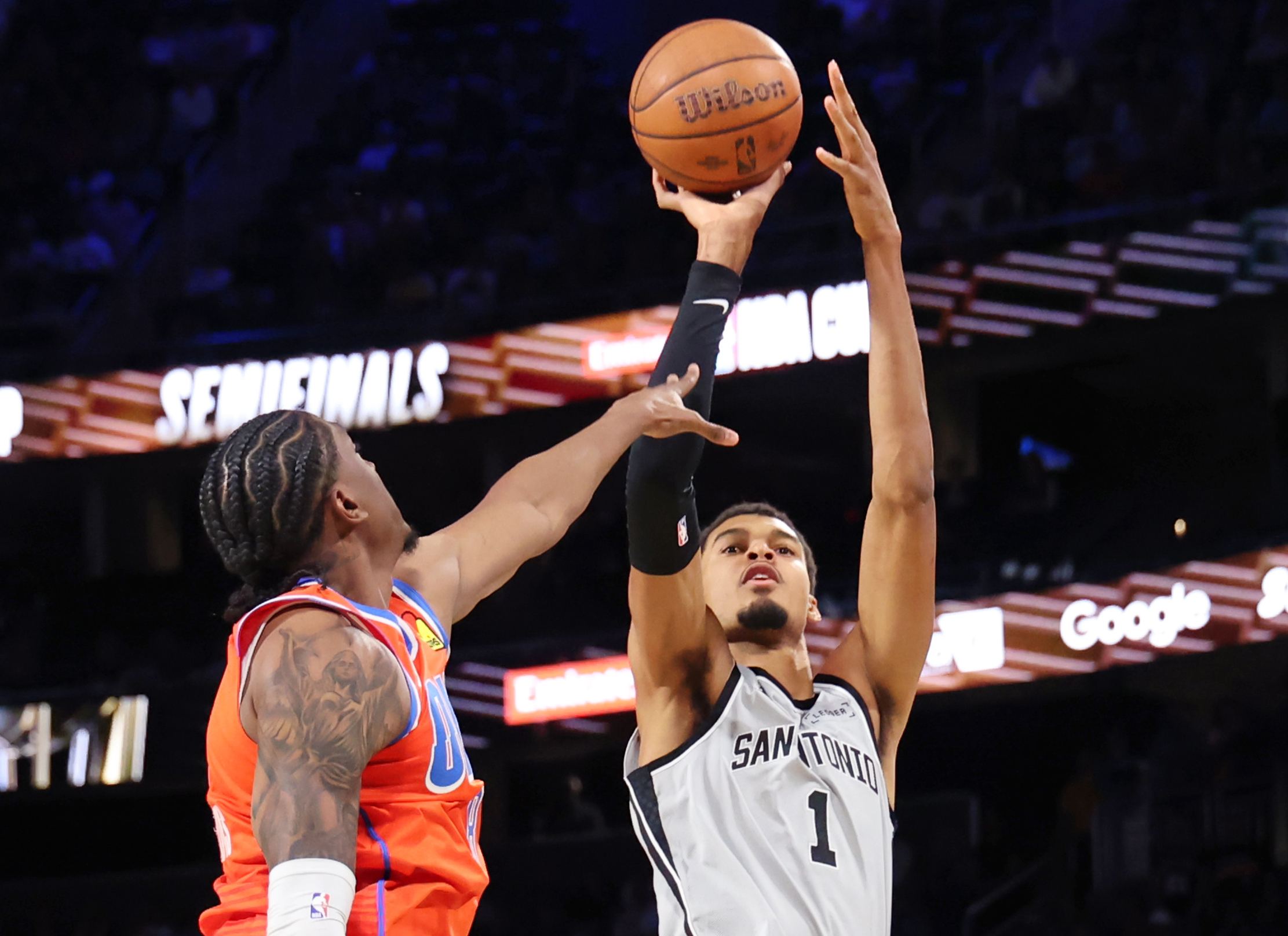 San Antonio Spurs forward Victor Wembanyama (1) shoots the ball near Oklahoma City Thunder guard Jalen Williams (8) in the second half of an NBA Cup semifinals basketball game, Saturday, Dec. 13, 2025, in Las Vegas.