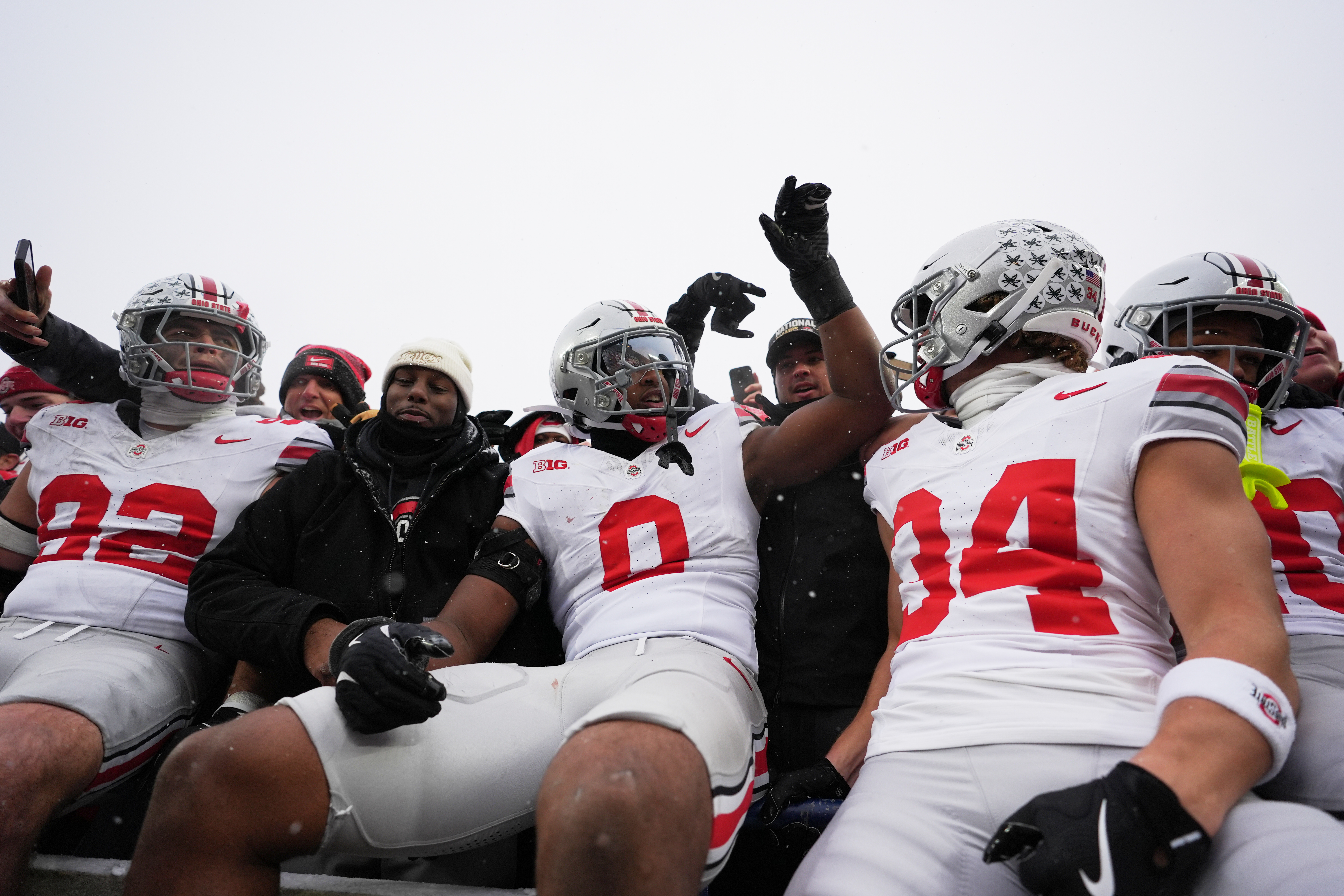 Ohio State Buckeyes defensive end Caden Curry, linebacker Sonny Styles, and wide receiver Brennen Schramm, from left, celebrate after the team's win against Michigan in an NCAA college football game, Saturday, Nov. 29, 2025, in Ann Arbor, Mich.