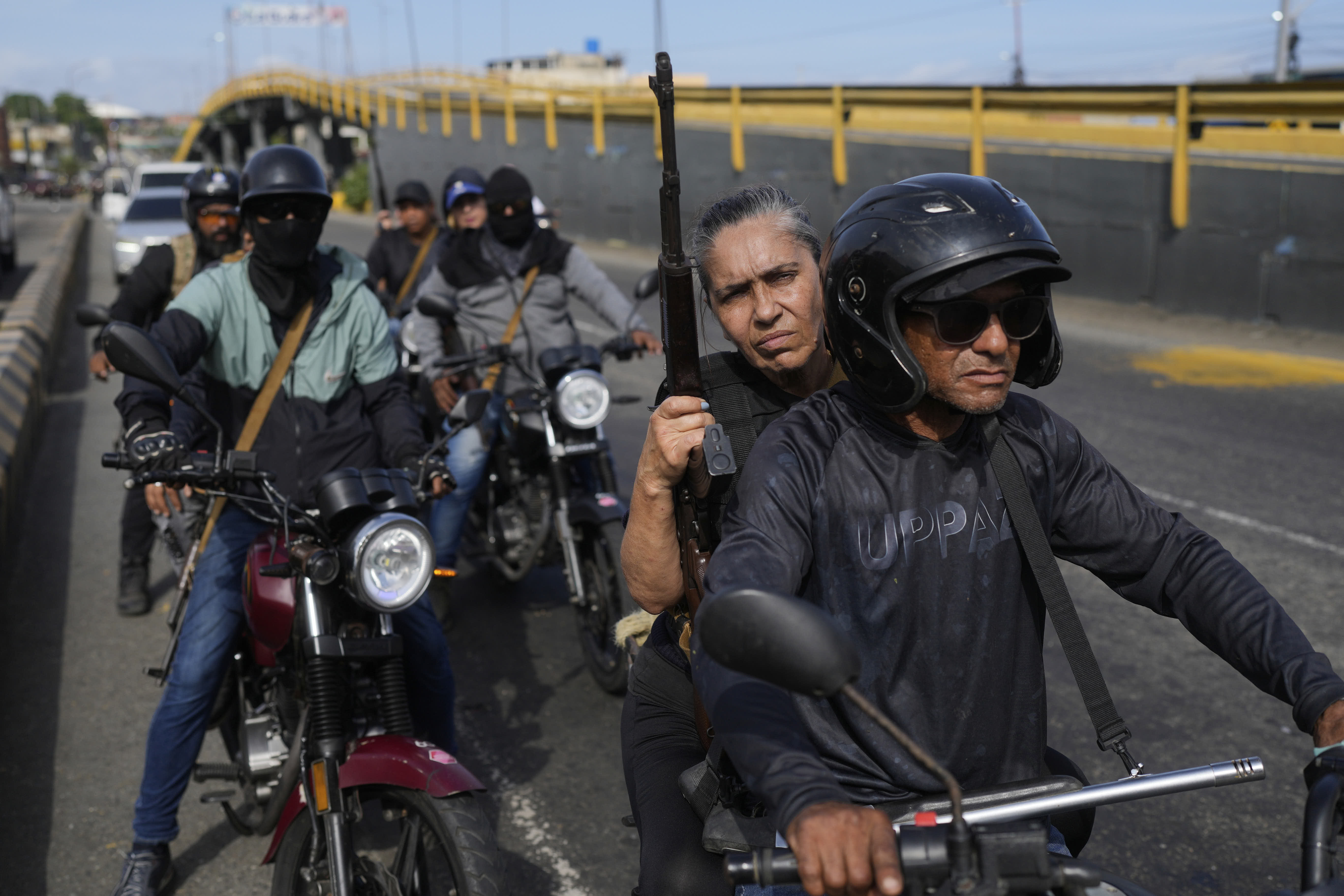 Armed civilians patrol the streets hours after President Nicolás Maduro was captured by US forces.